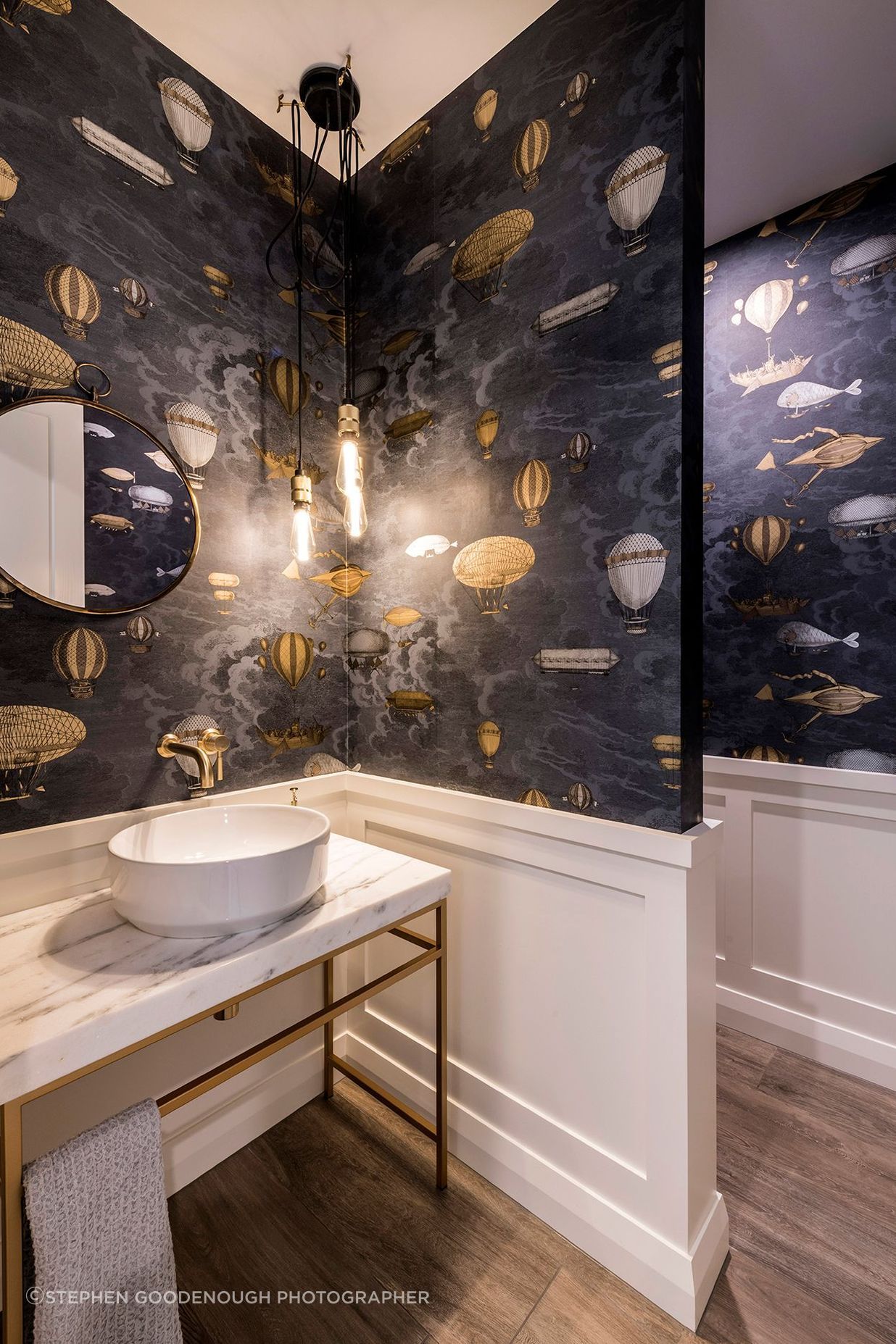 Brass and marble are elegantly used in the bathrooms.