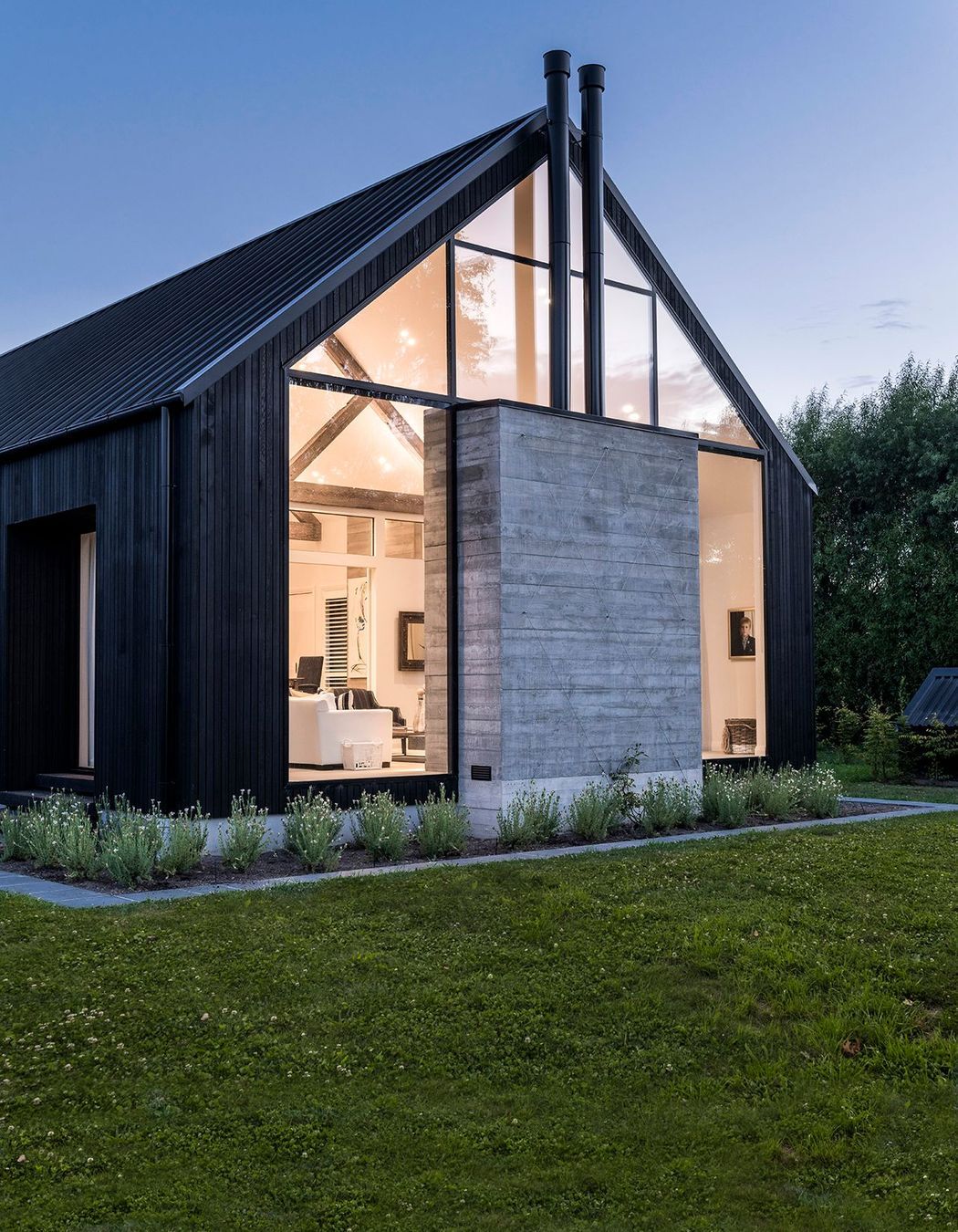 Expansive glazing creates stunning views into the home, expecially at night.