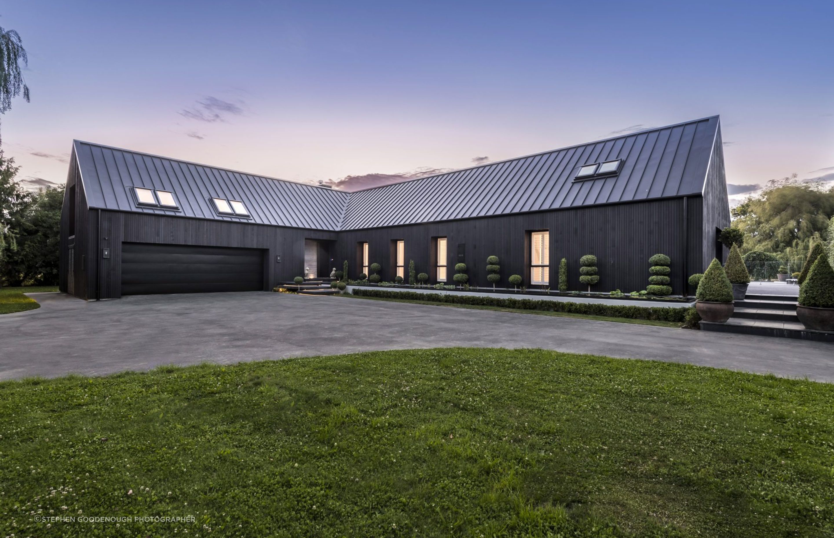 The garage joins up with the main entrance of Ohoka House, with its reflective pool stretched along the length of the form.