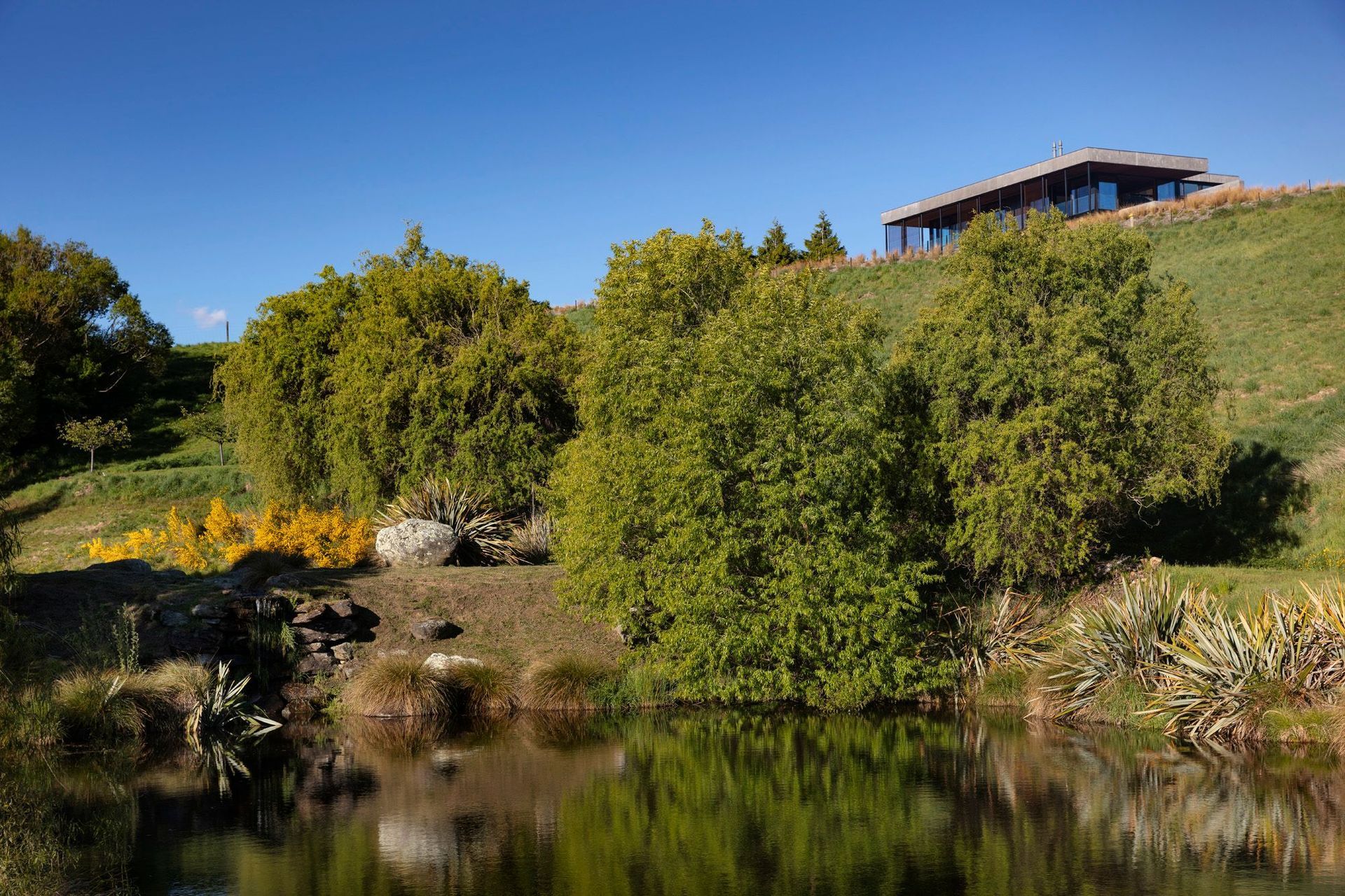 Olivers Ridge hunkers into a hill that overlooks a small lake.