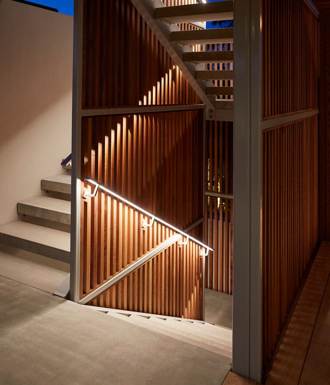 Custom built stairwell handles feature under-lit lighting to guide during darkness. Calley Homes | Tauranga Builders