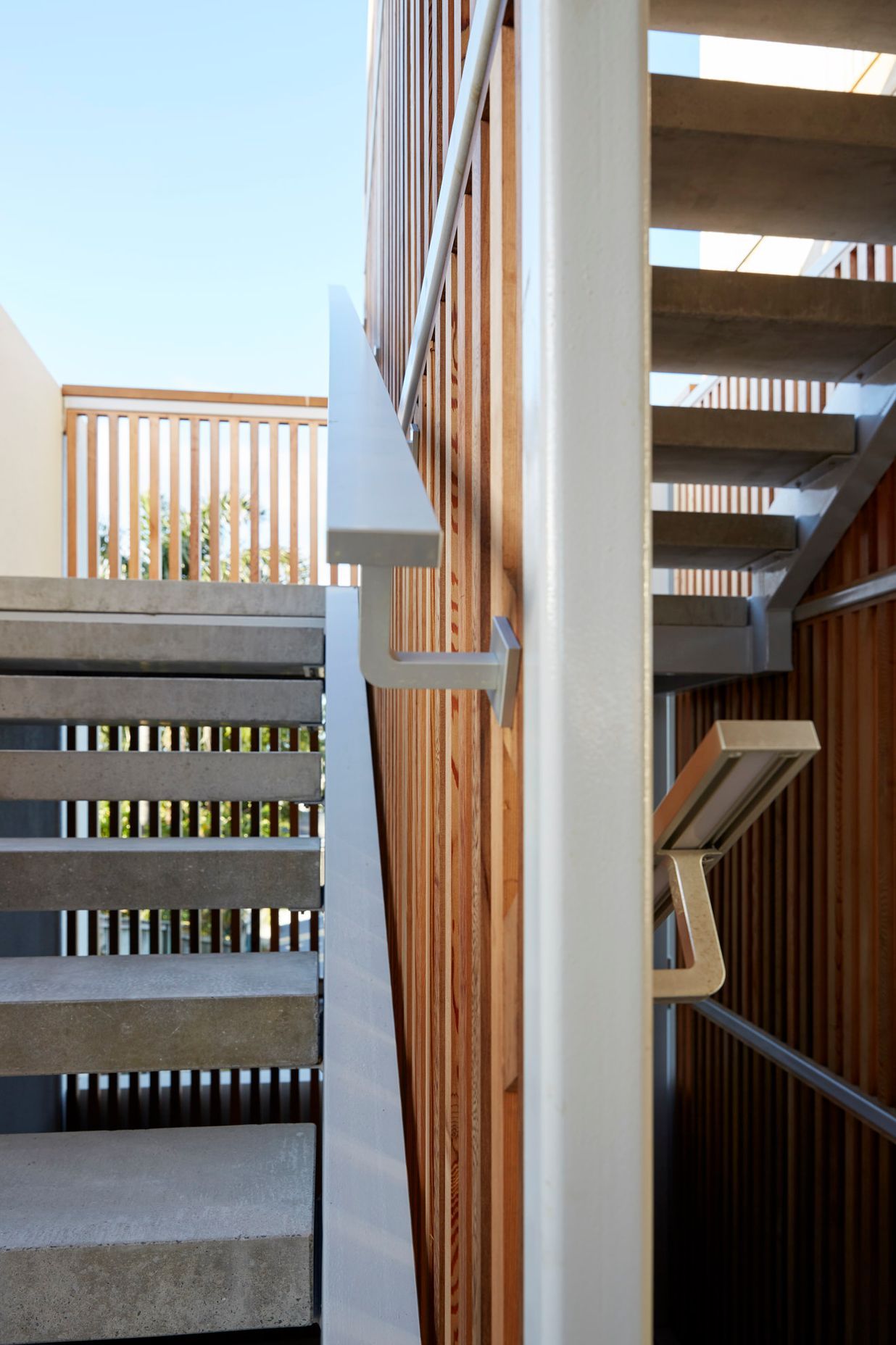An external staircase links the middle level with the top level. Internally, there is lift access as well as another staircase.
