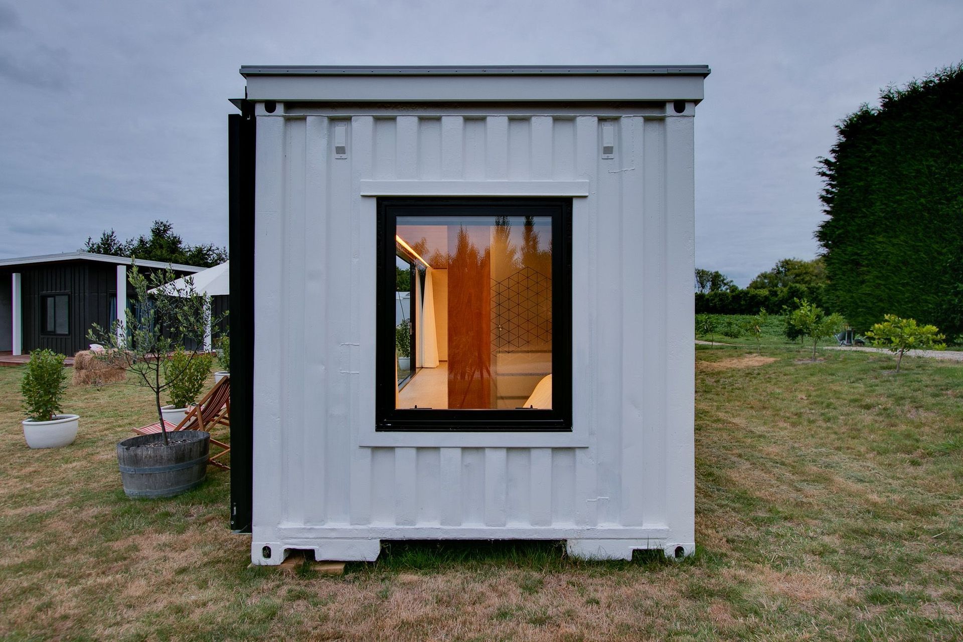 Containers are not designed to be habitable so there is a process to go through to modify them and ensure they are compliant.