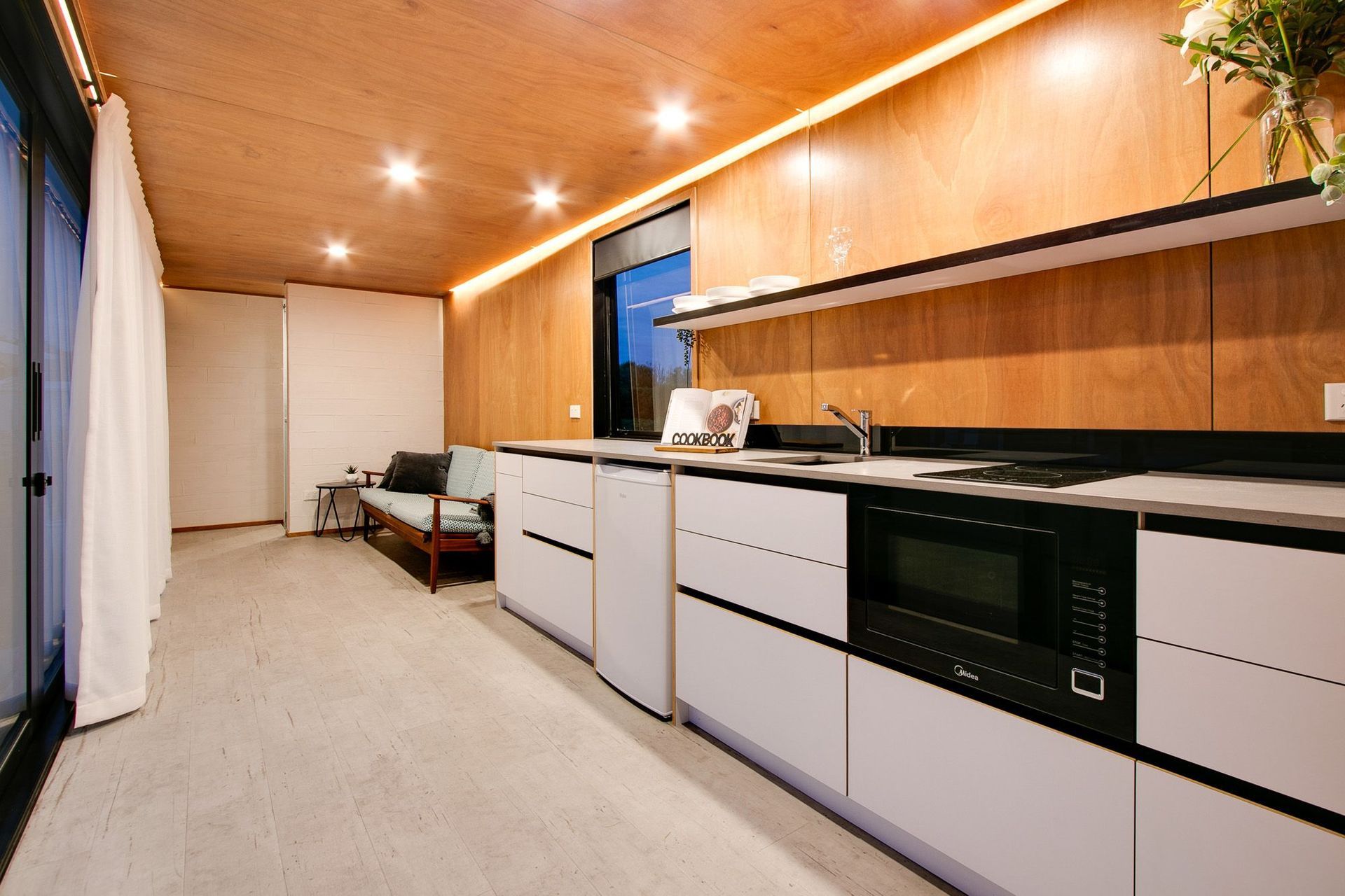 The simple kitchen and lounge area.