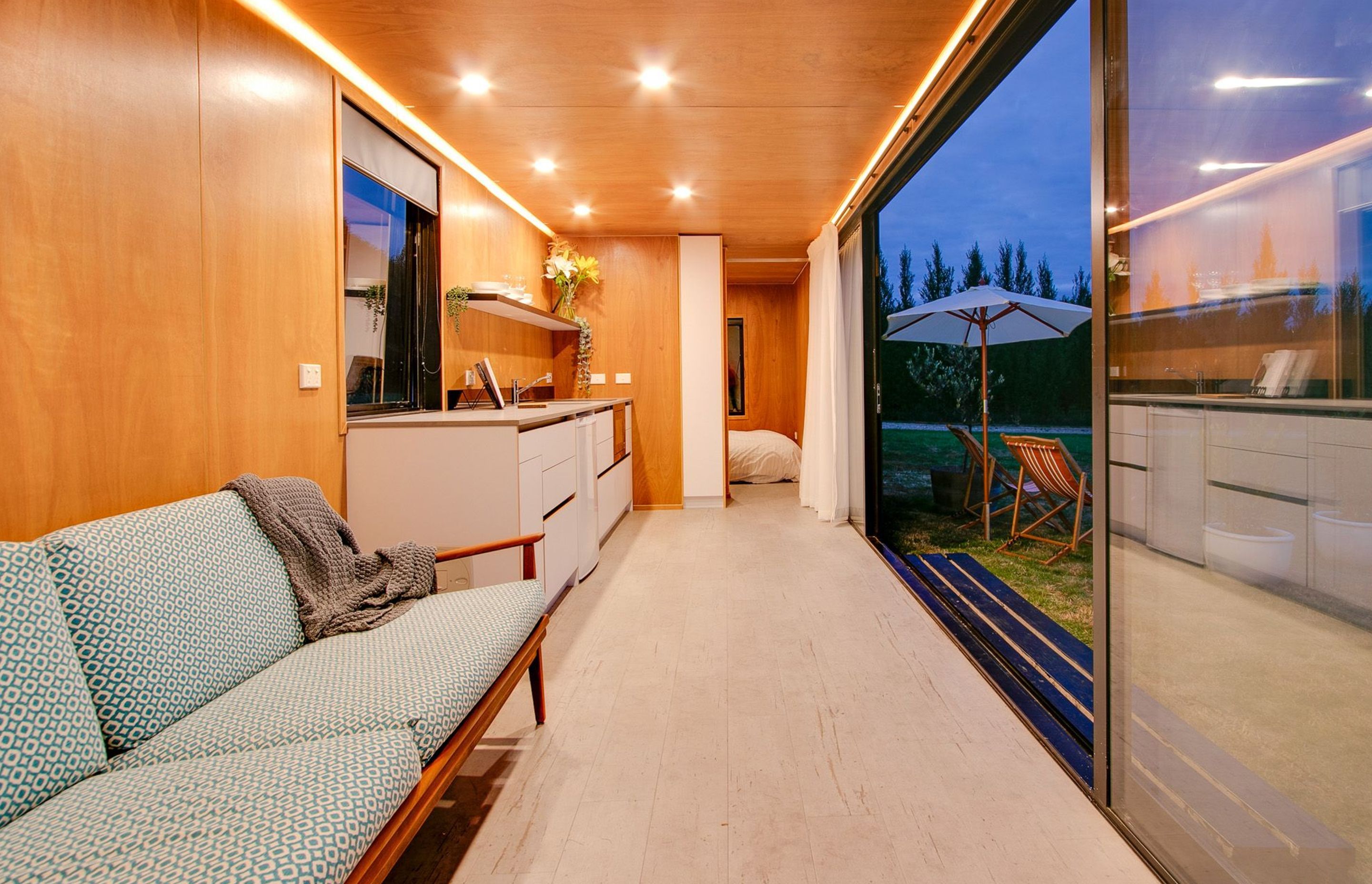 The living and kitchen area leads into the bedroom via a sliding door.