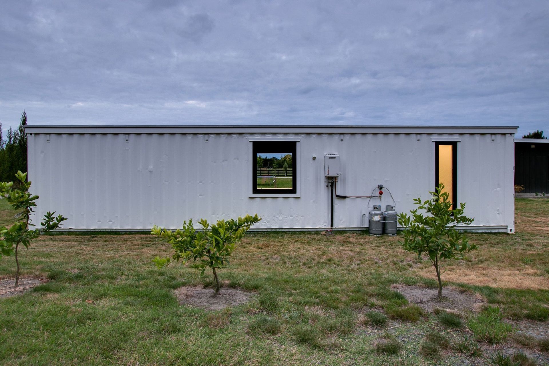 Even the rear of the container has windows that have been cut into the shipping container to bring light into the interior.