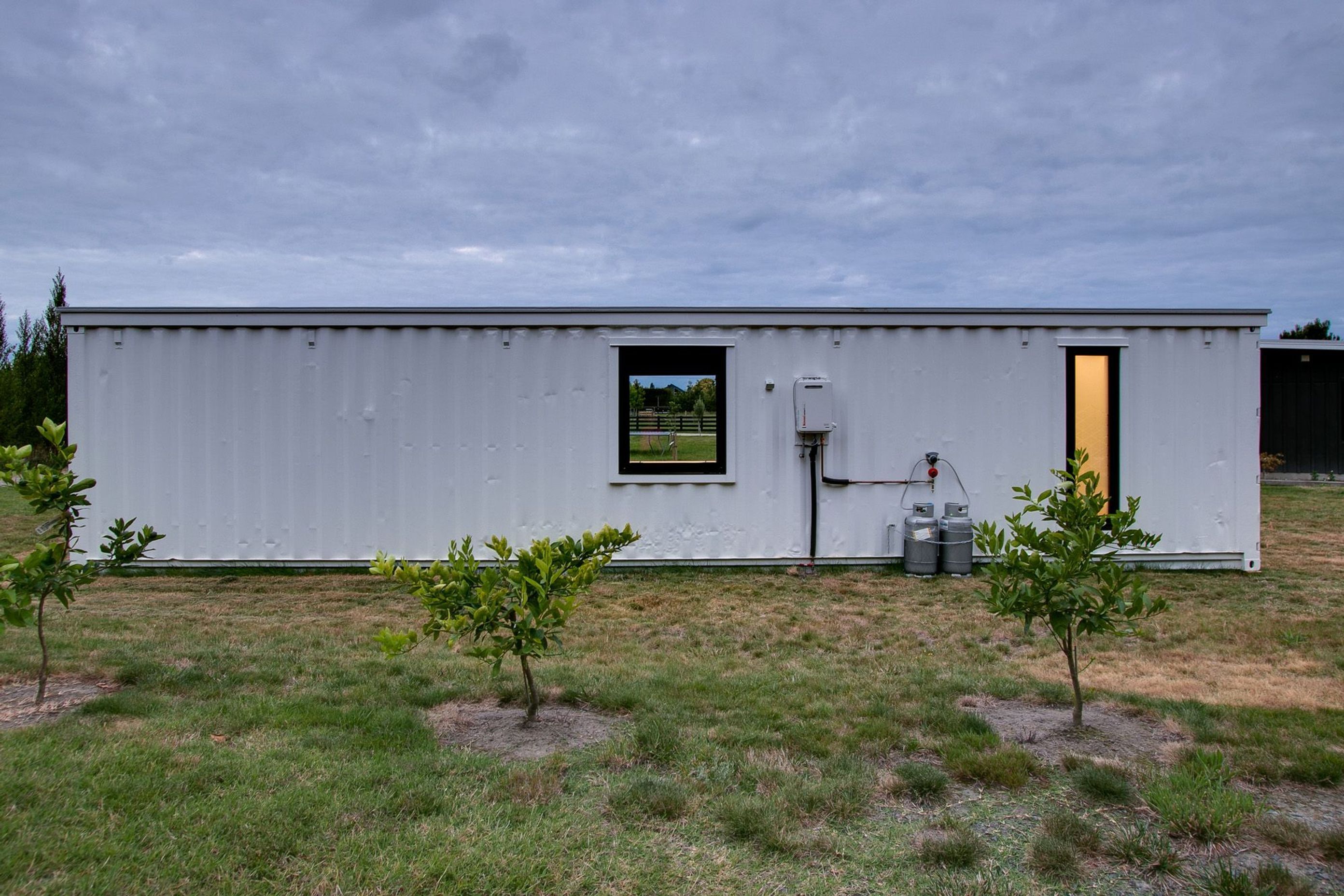 Even the rear of the container has windows that have been cut into the shipping container to bring light into the interior.