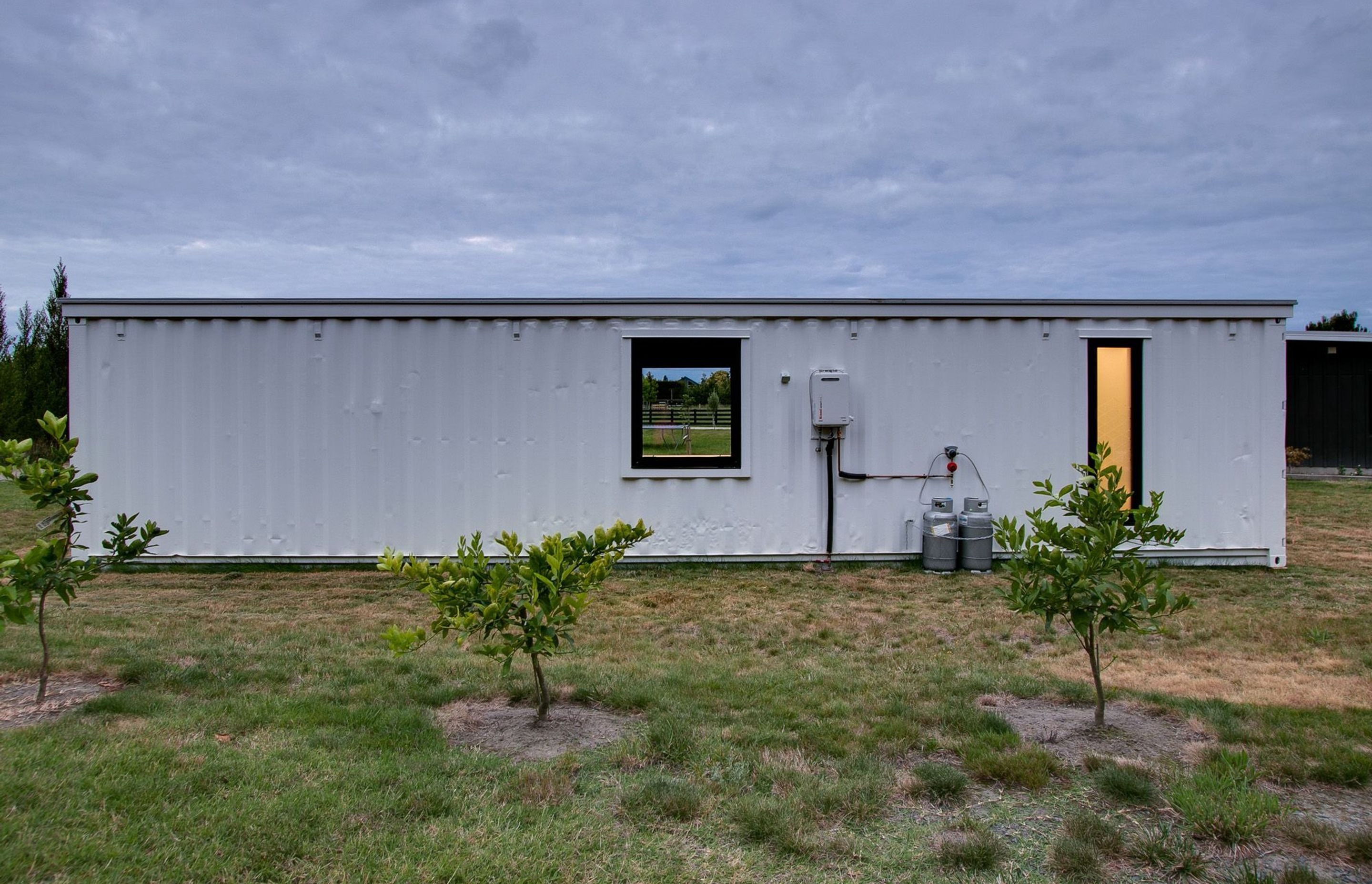 Even the rear of the container has windows that have been cut into the shipping container to bring light into the interior.