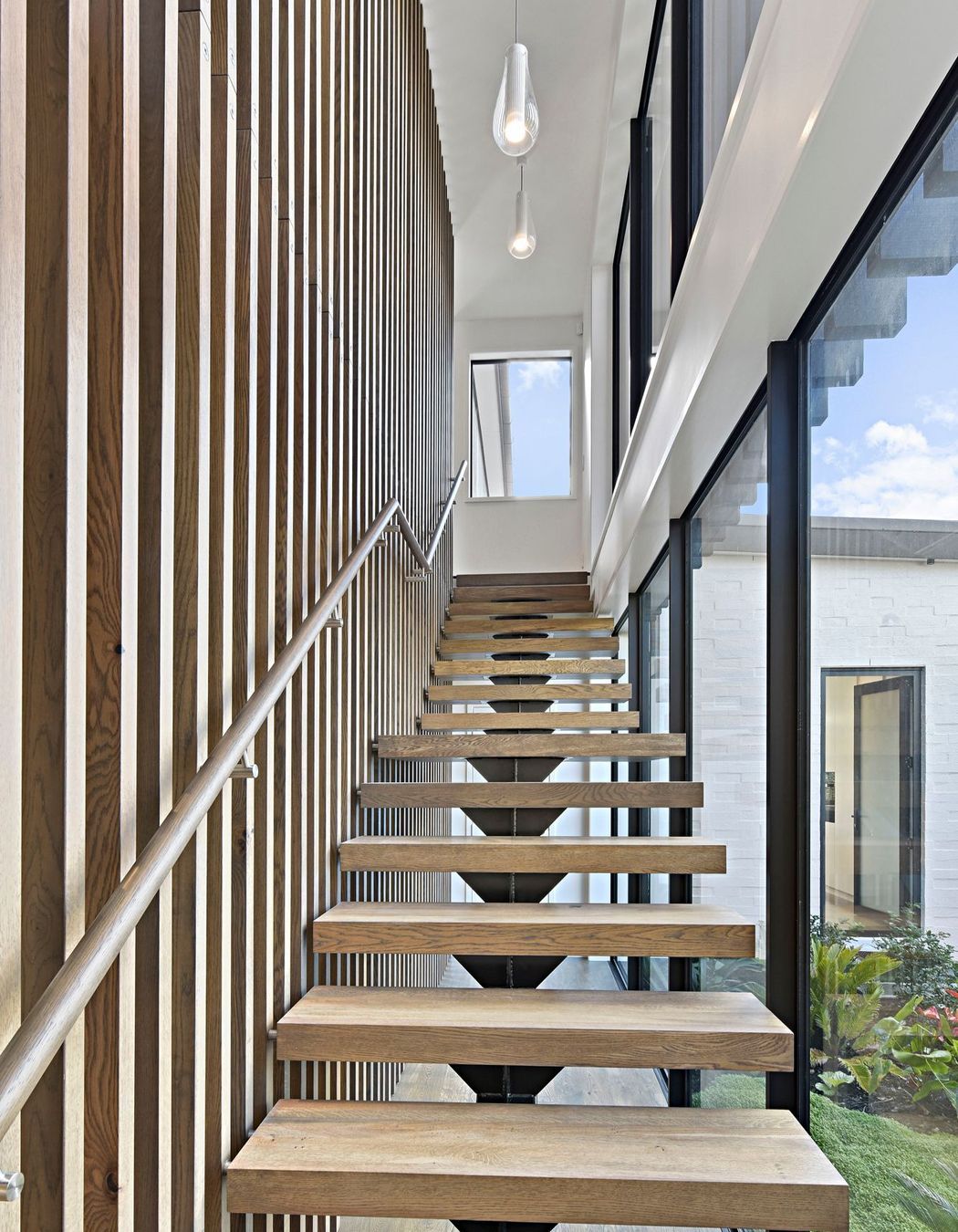The stained oak staircase evokes the sensation of luxury. It is here that the passion and effort put in by the builders is clear and elevates the unique character of this home.