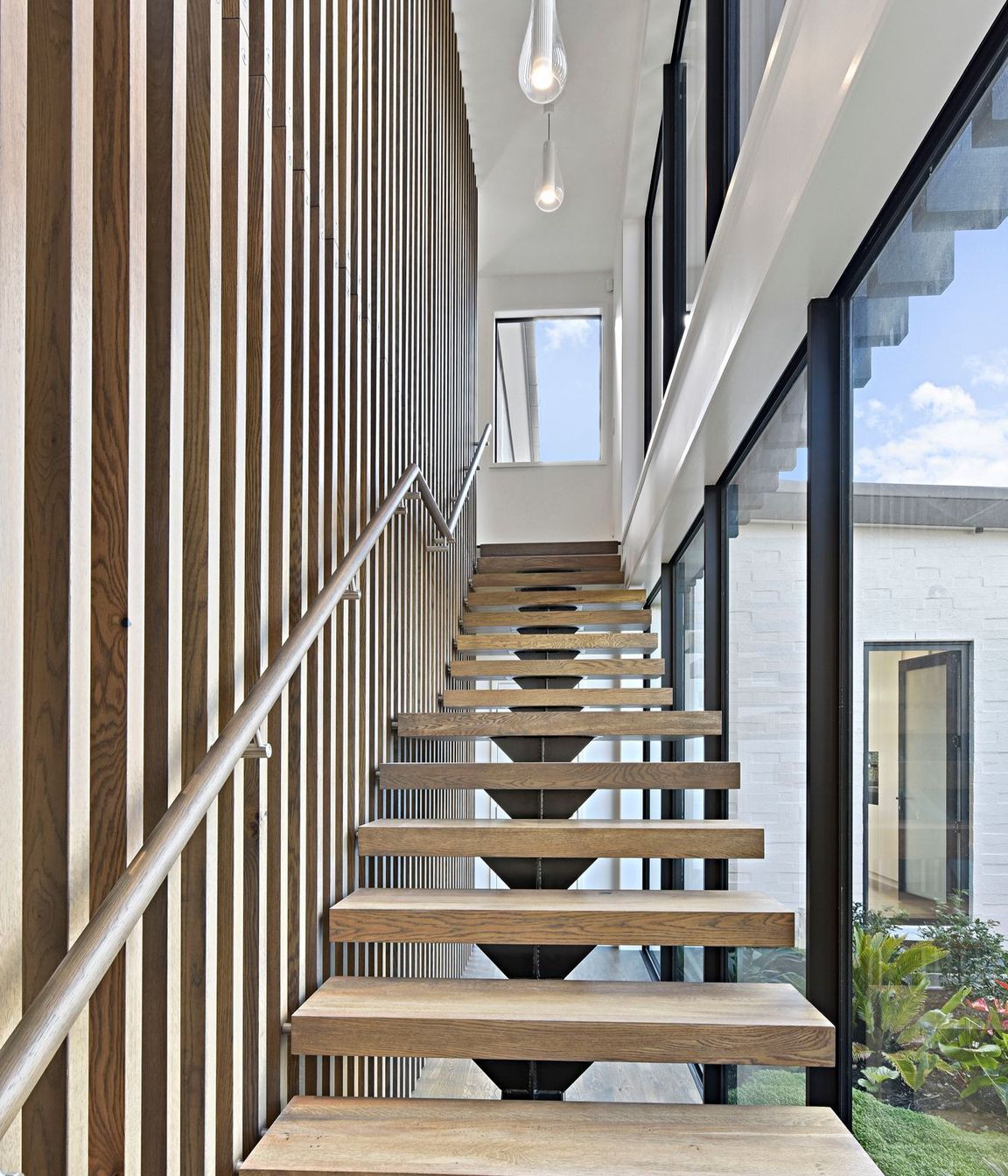 The stained oak staircase evokes the sensation of luxury. It is here that the passion and effort put in by the builders is clear and elevates the unique character of this home.