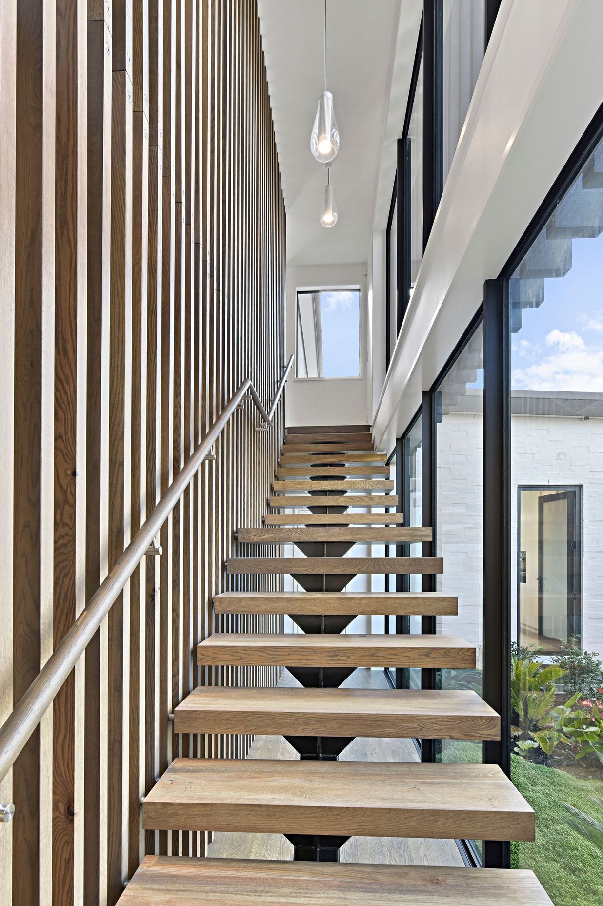 The stained oak staircase evokes the sensation of luxury. It is here that the passion and effort put in by the builders is clear and elevates the unique character of this home.