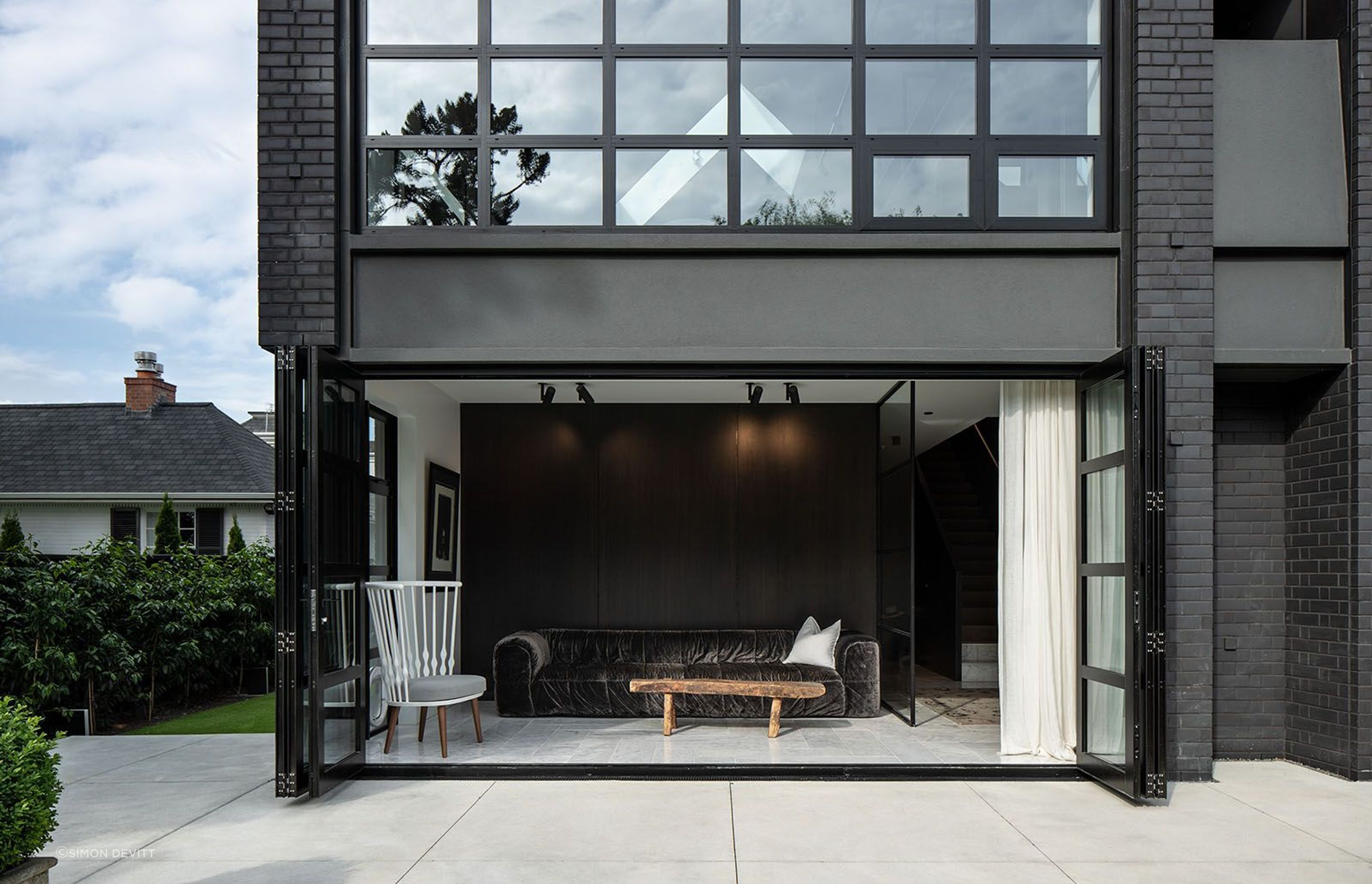 The lower courtyard opens out from a second living area, while next to it an unexpected alcove adds a sense of what could have been.