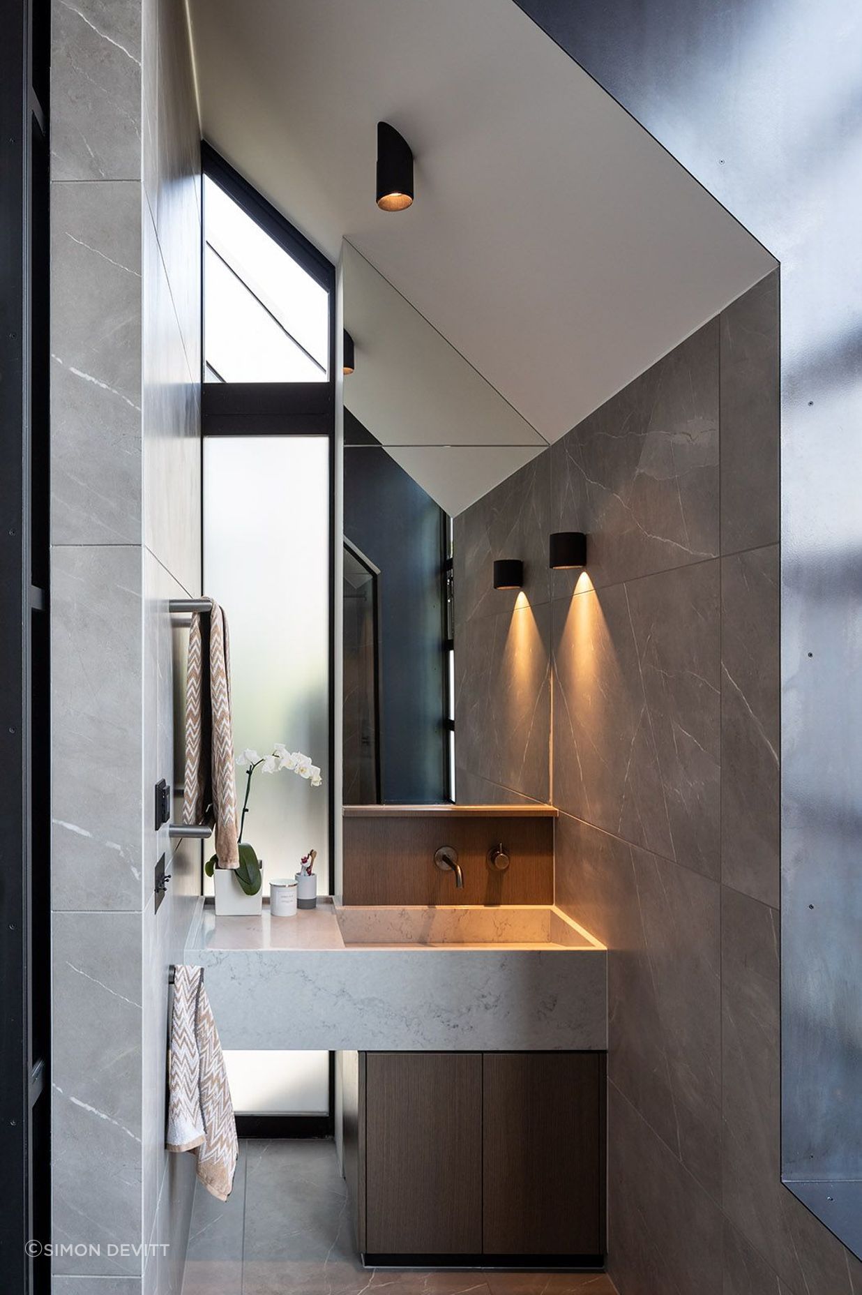 The ensuite bathroom is defined by the pitched roofline.