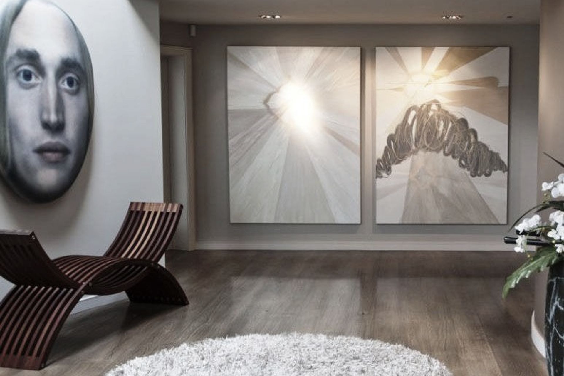 I was able to persuade my clients to hang two large Luise Fong paintings side by side on the far rectangular wall. The space allowed for this, and together they create impact.