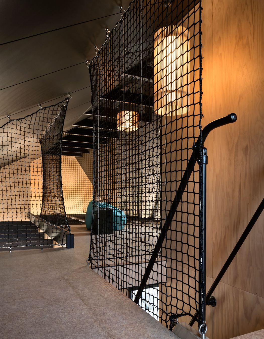 The mezzanine / loft with the floor-to-ceiling black tension screens.