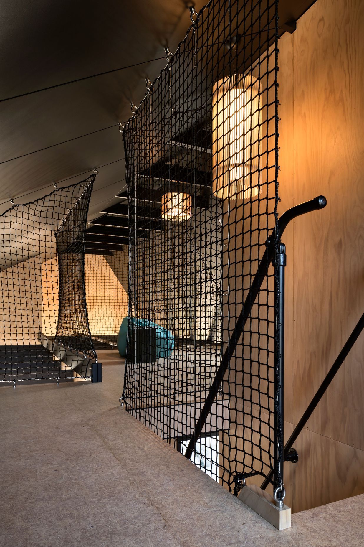 The mezzanine / loft with the floor-to-ceiling black tension screens.