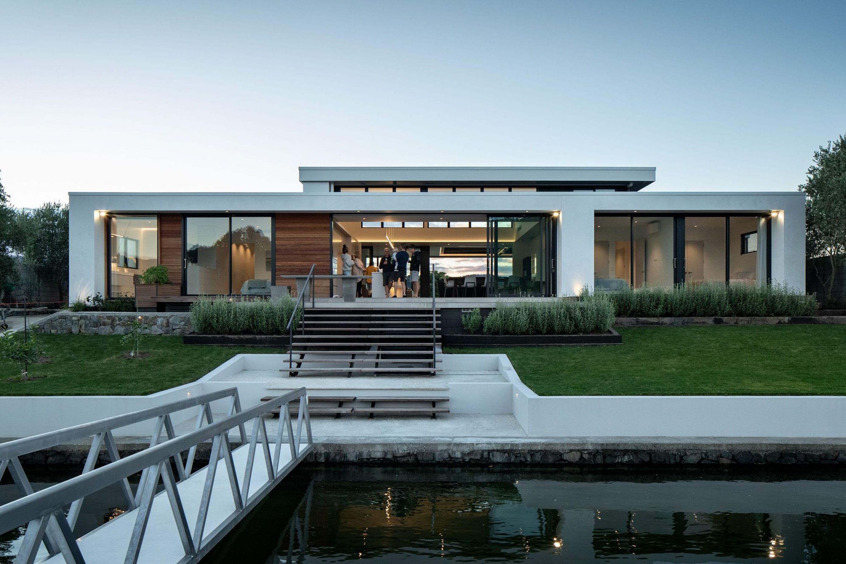 The view of Pauanui Vice from the boat dock showcases its simple modernist forms.