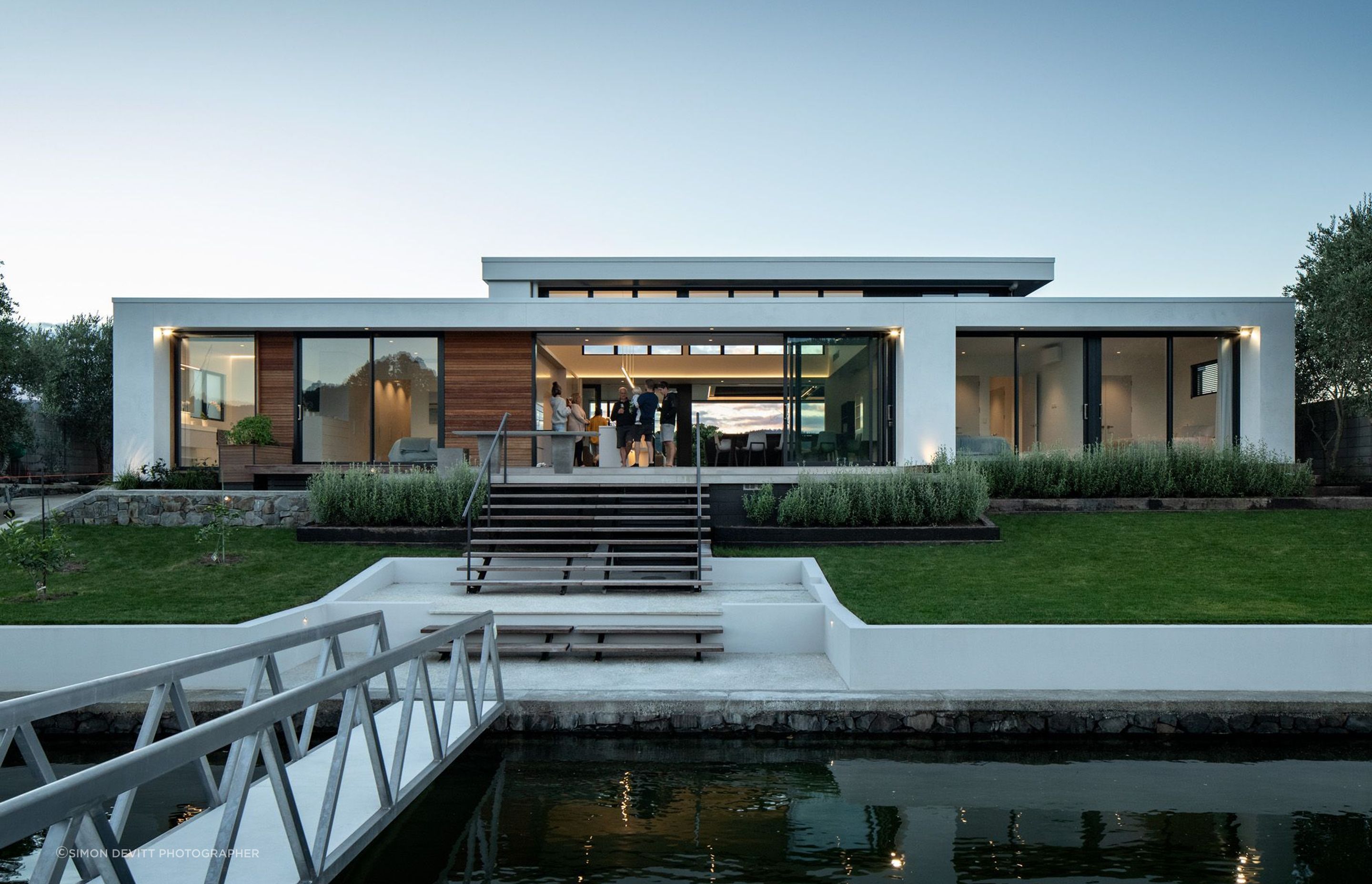 The view of Pauanui Vice from the boat dock showcases its simple modernist forms.