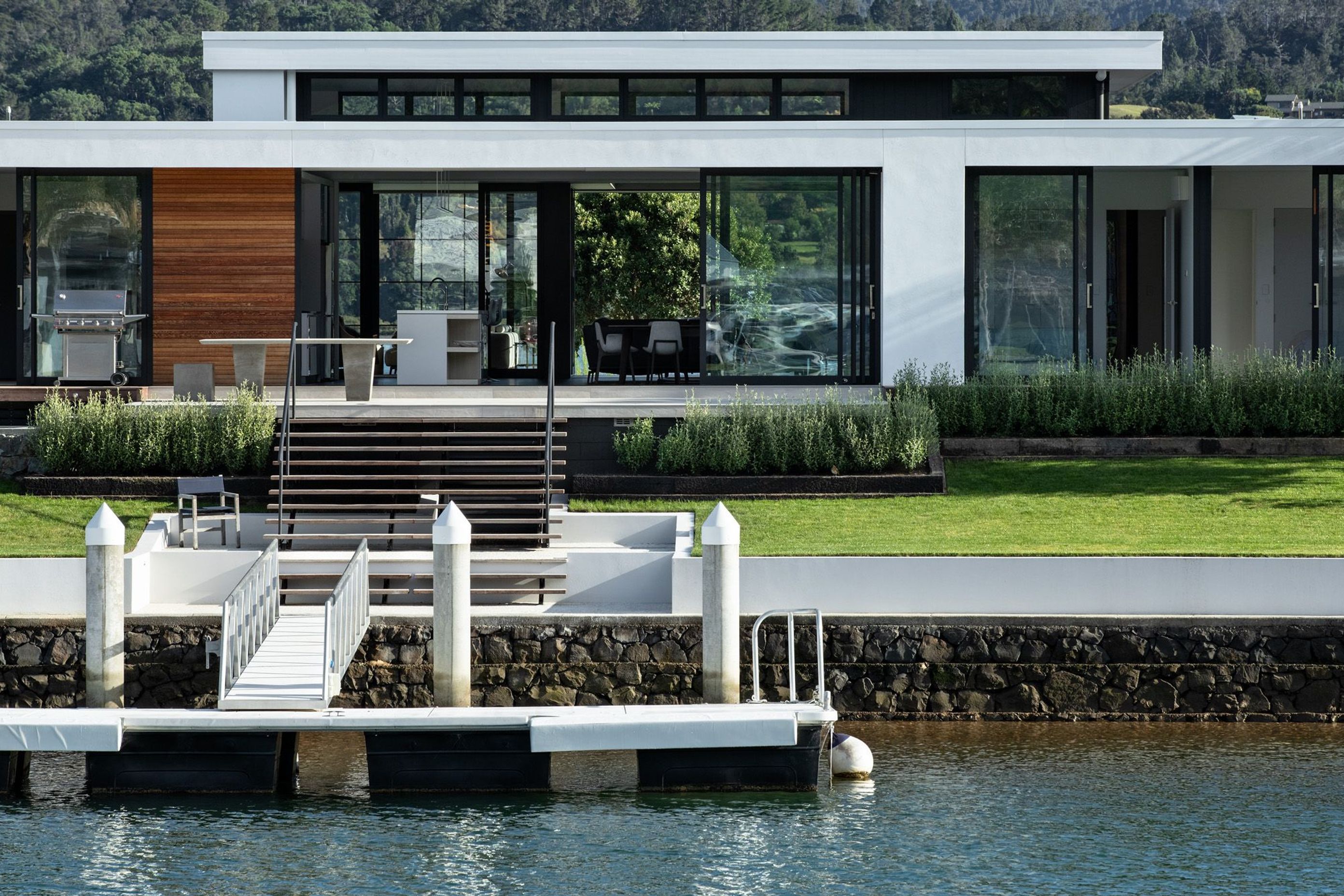 Sited right beside the canal, this home is designed for a boat-lovers' lifestyle in mind, with flexible indoor/outdoor living and durability as major considerations.