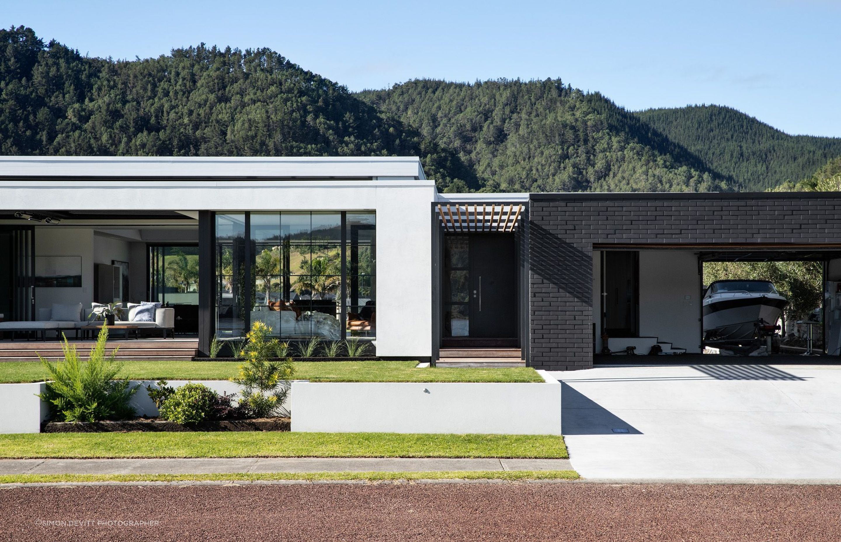 The garage opens up on both sides, providing easy access to both the street and the canal.