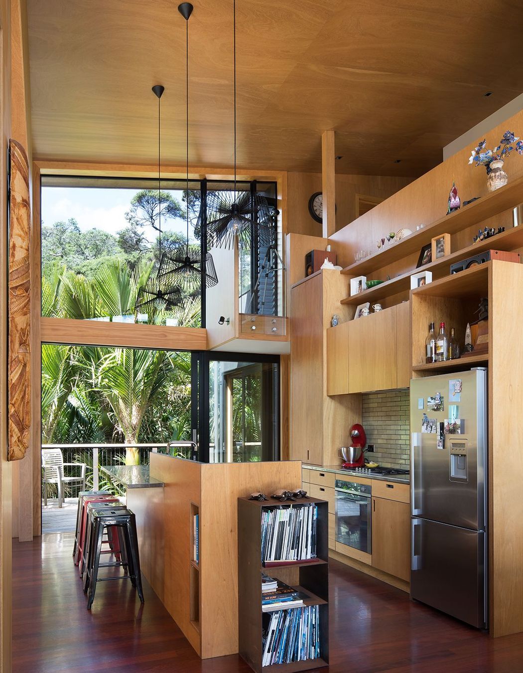 The captain's nest on the mezzanine level floats out into the kitchen.