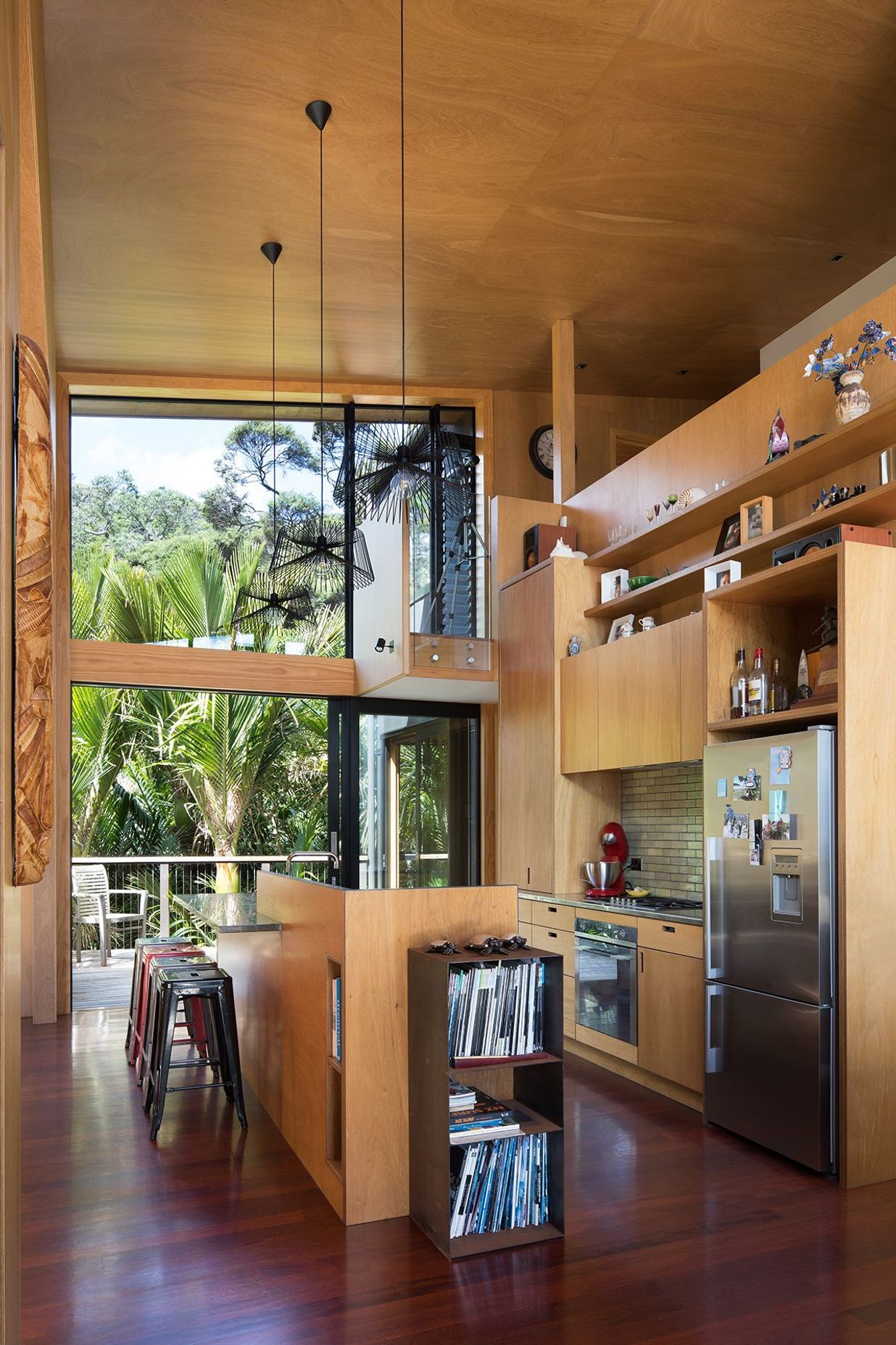 The captain's nest on the mezzanine level floats out into the kitchen.