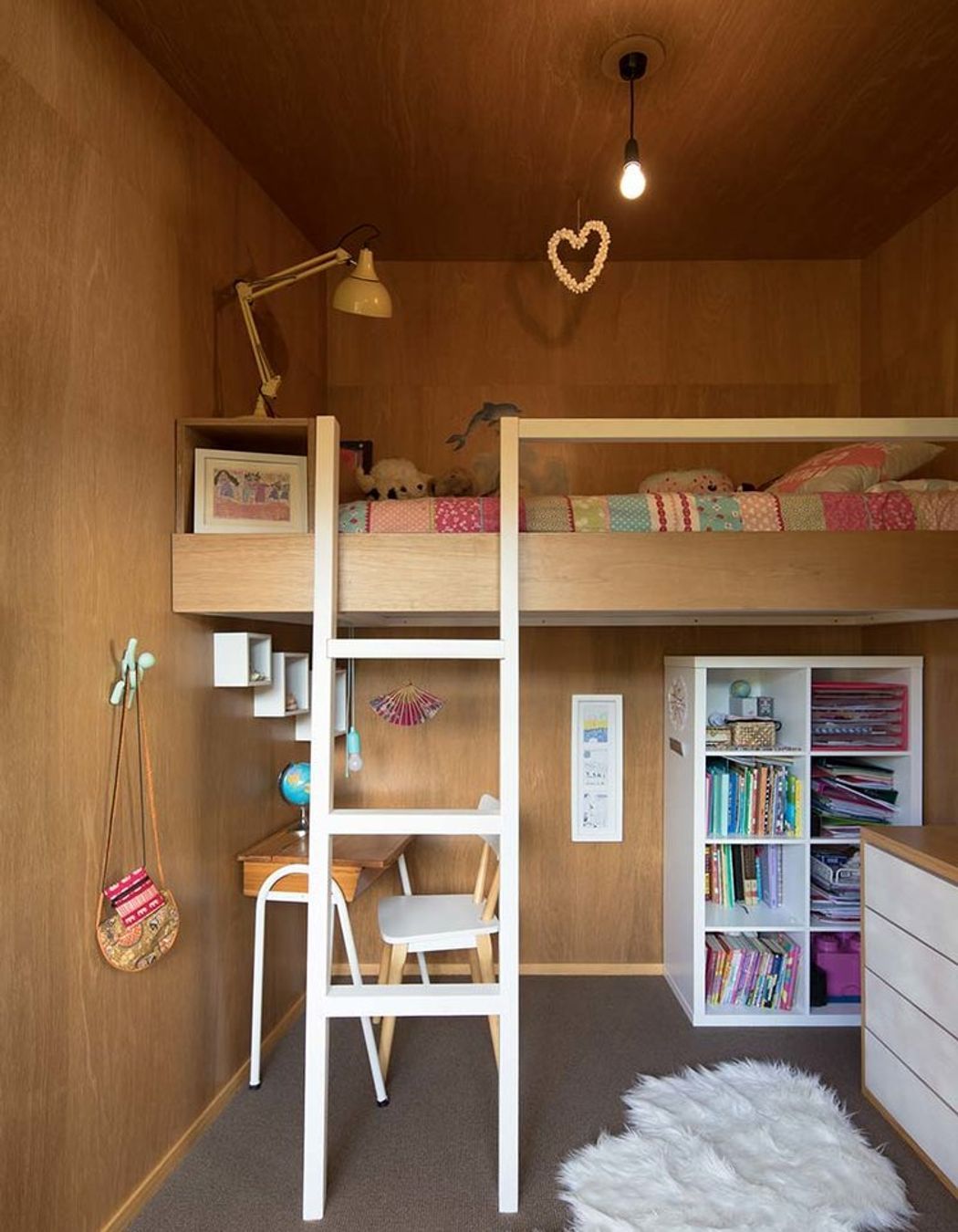 The use of plywood in the construction allows for clean, complimentary in-built furniture.