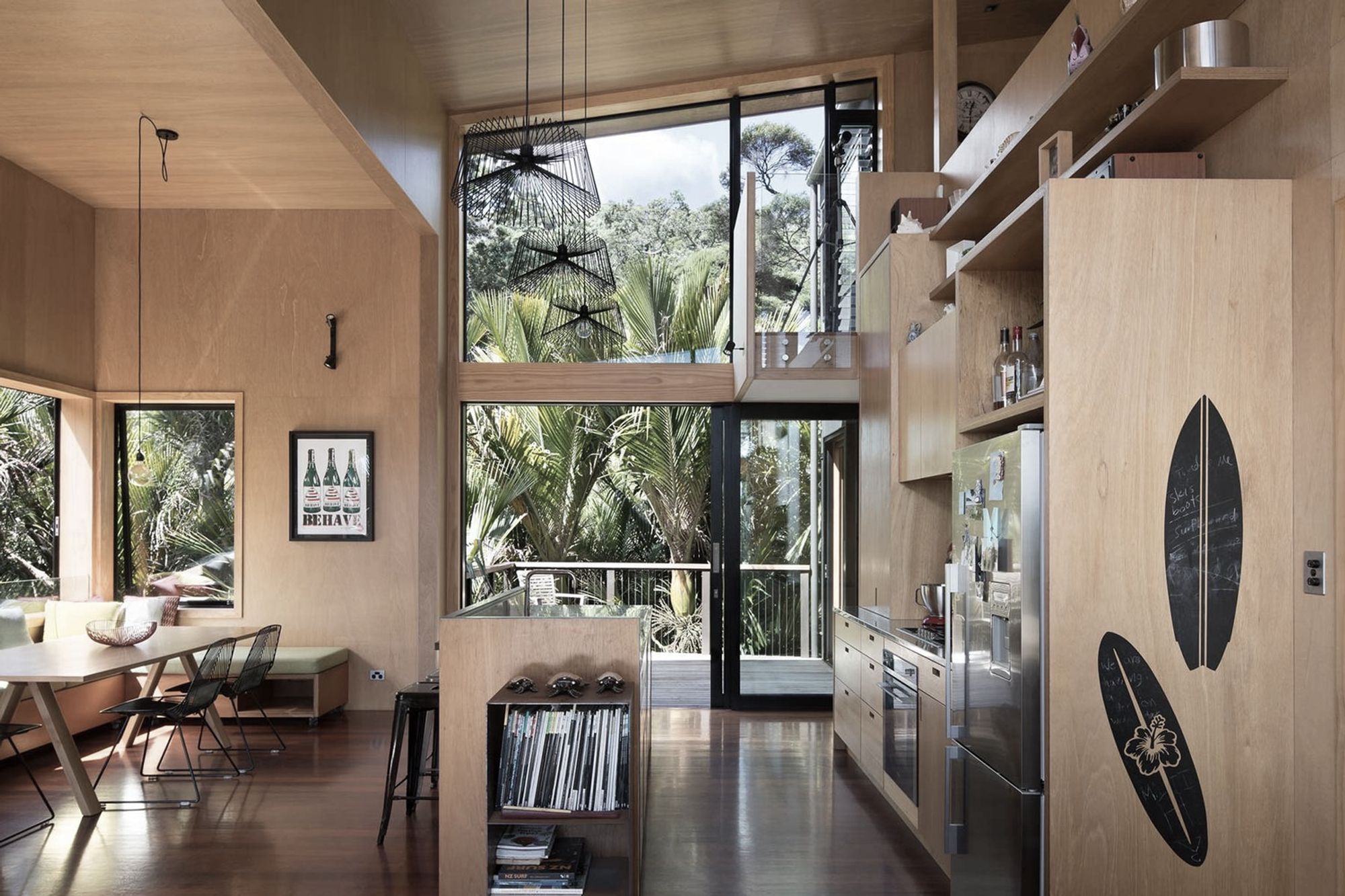 A high ceiling due to the mezzanine design creates a sense of space within the small footprint of the home. Extensive use of high-grade plywood compliments the bush environment the house exists in.