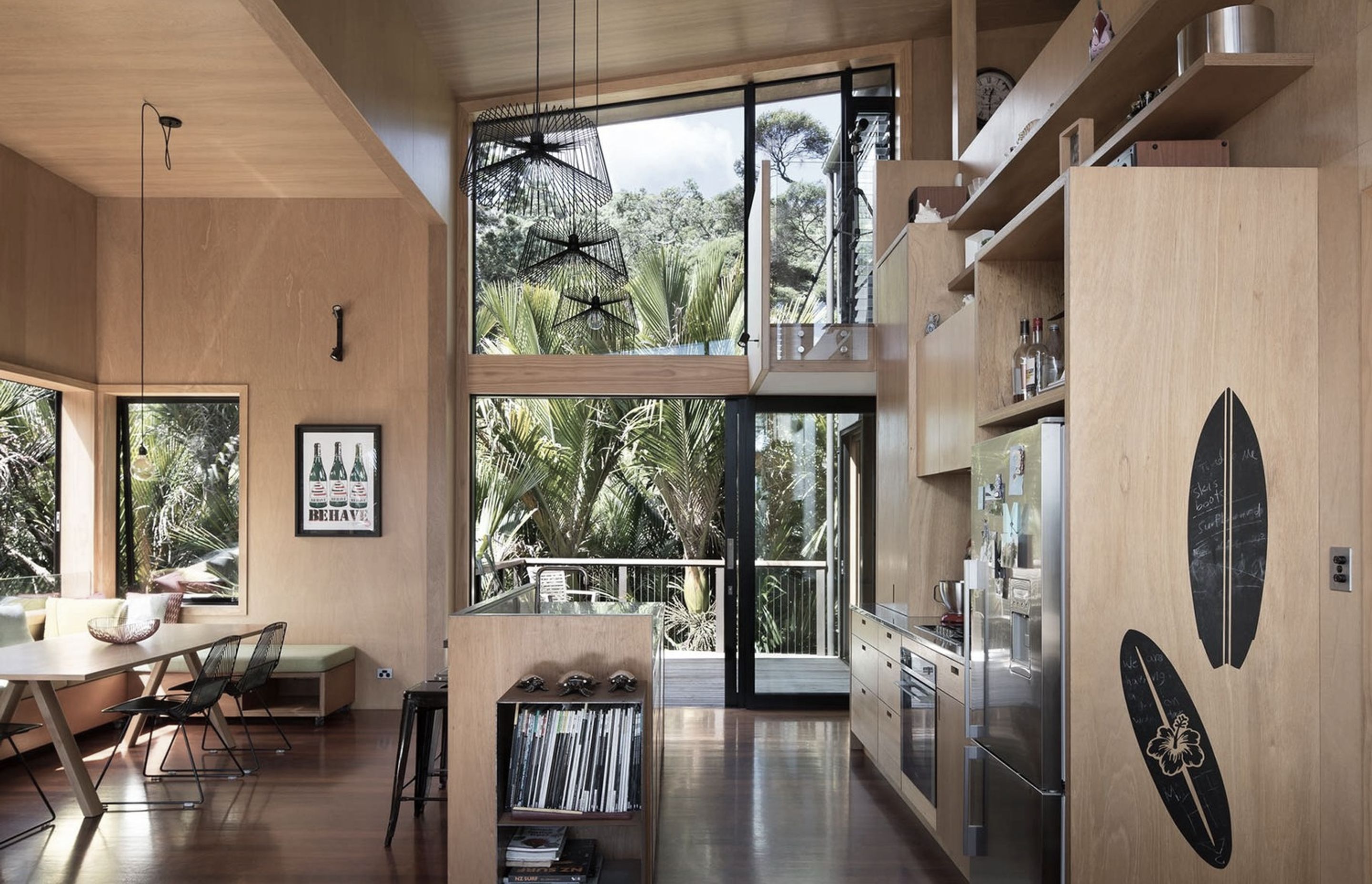 A high ceiling due to the mezzanine design creates a sense of space within the small footprint of the home. Extensive use of high-grade plywood compliments the bush environment the house exists in.