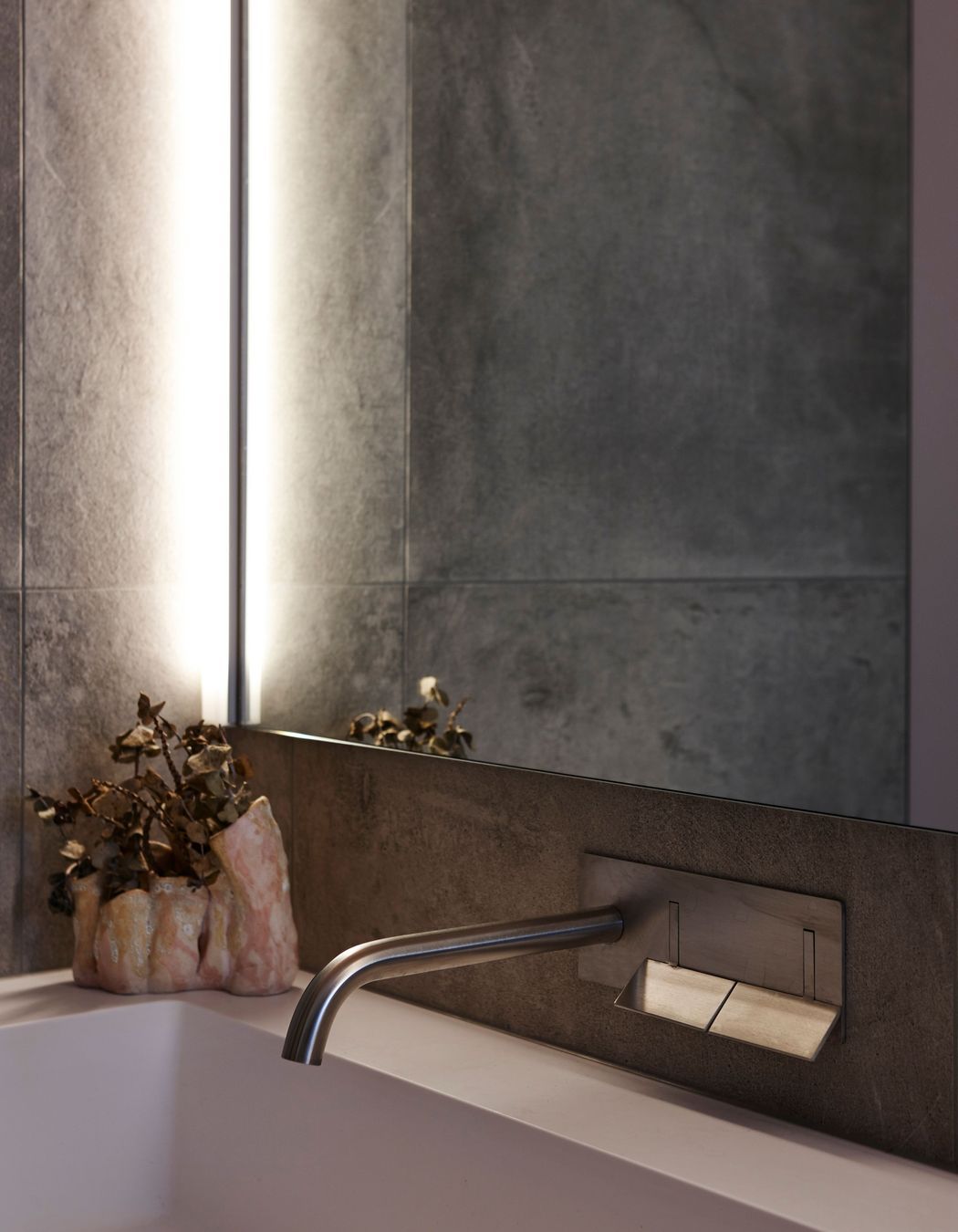 Subtle pink hues underscore the interior palette.