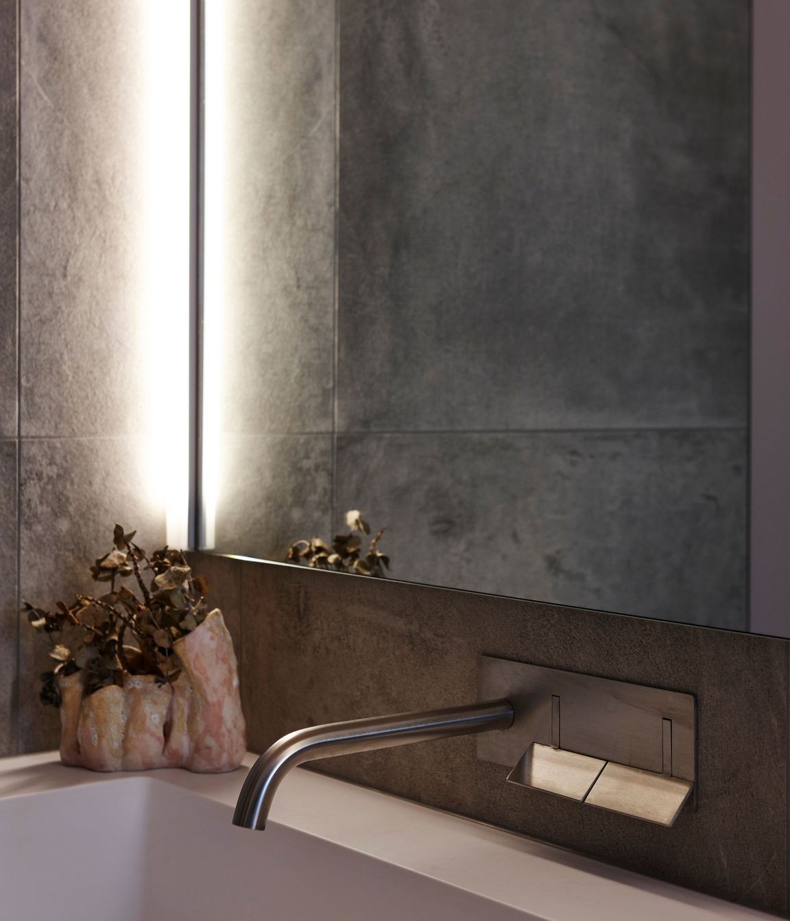 Subtle pink hues underscore the interior palette.