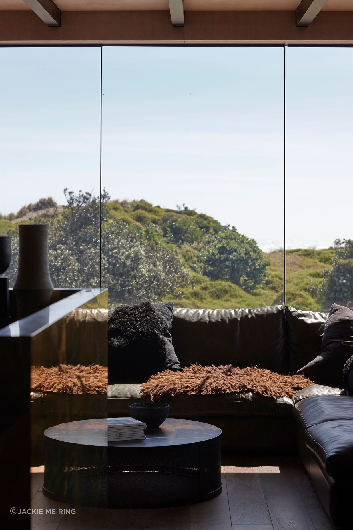 Low-E glass contributes to the feeling that the home is only moments away from being plunged into the elements.