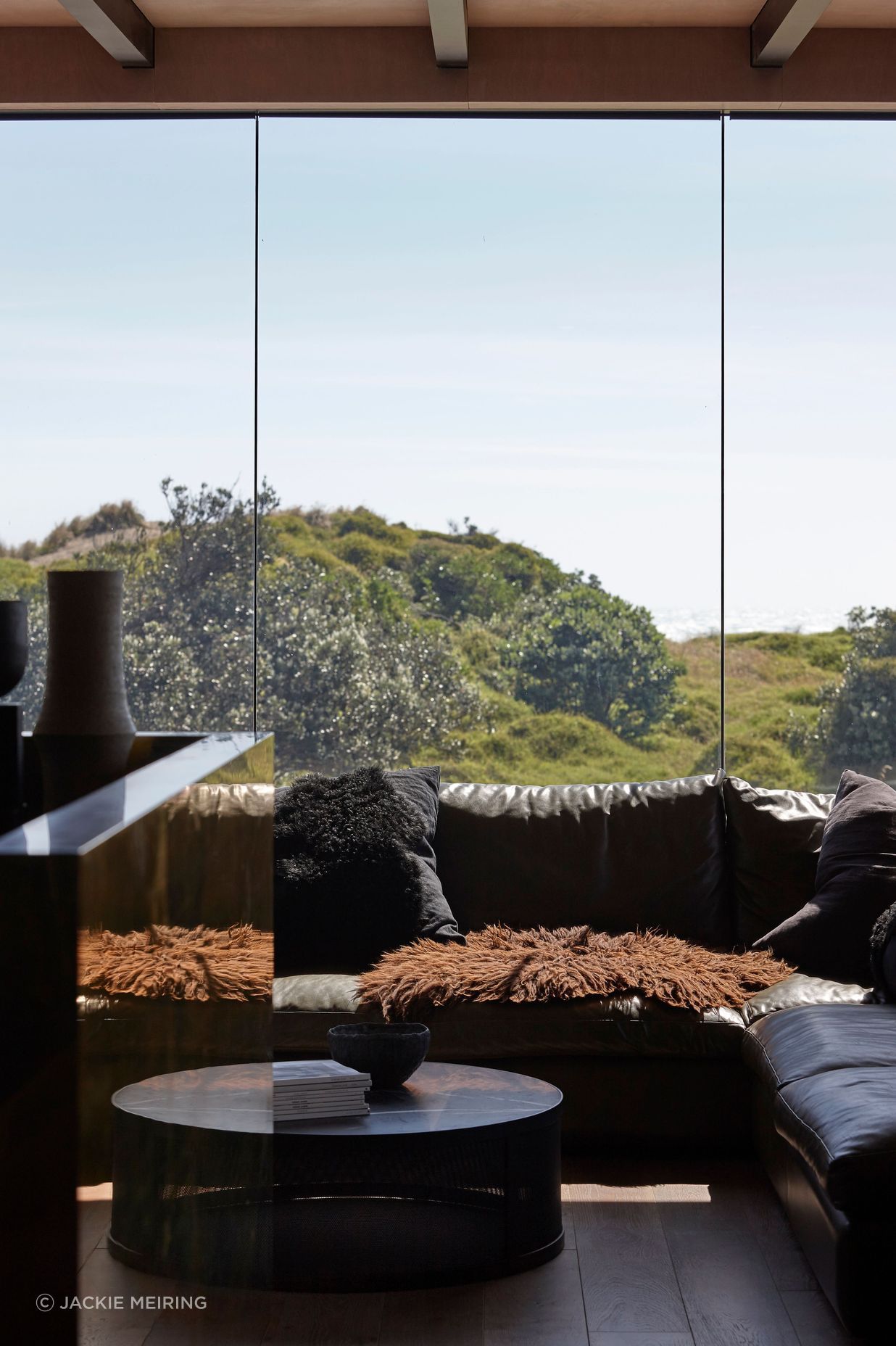 Low-E glass contributes to the feeling that the home is only moments away from being plunged into the elements.
