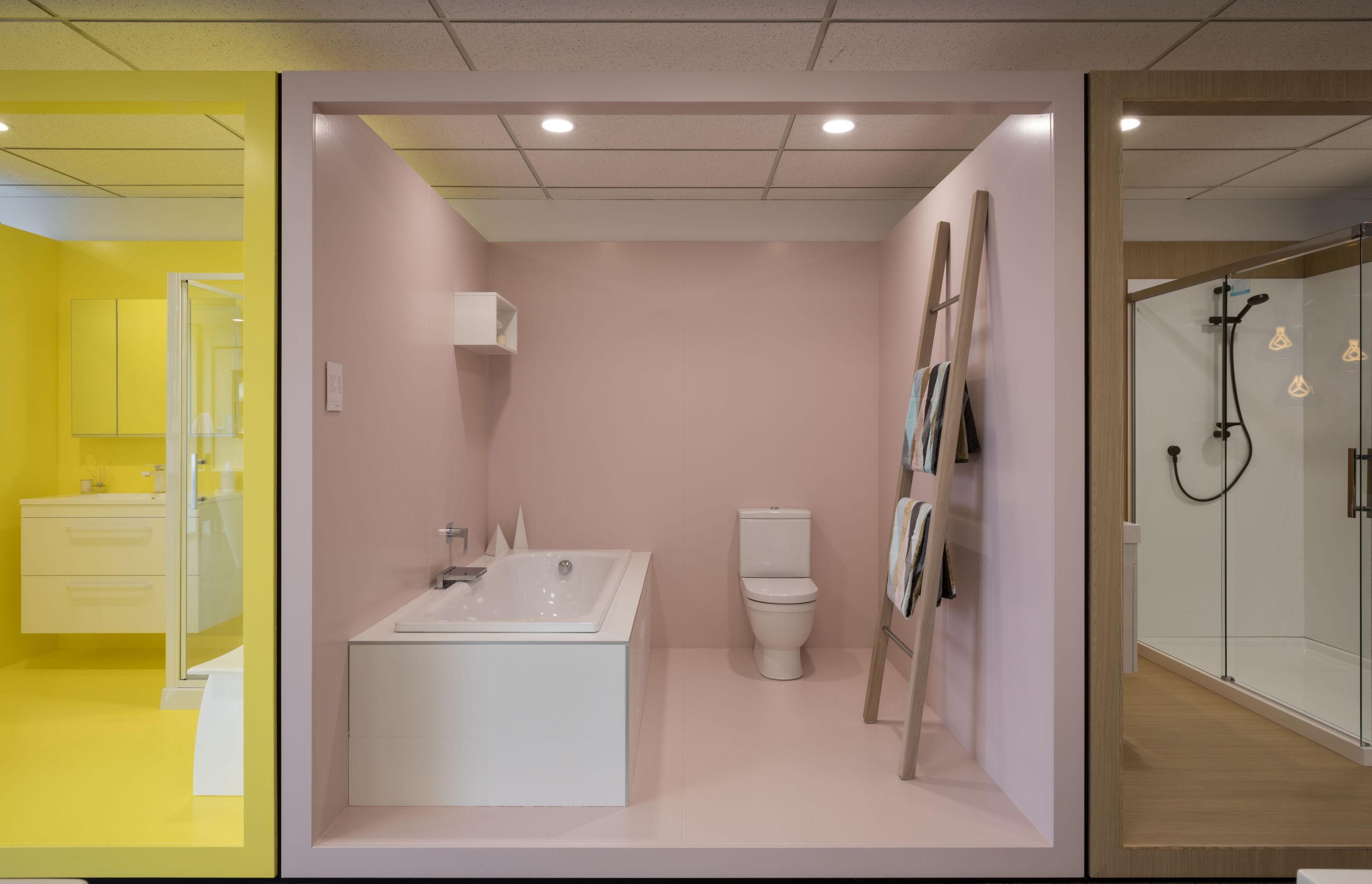 Room pods emerse the client in various moods and make the product hero: yellow, pink, wood and blue create visual interest from the street and draw clients into the showroom