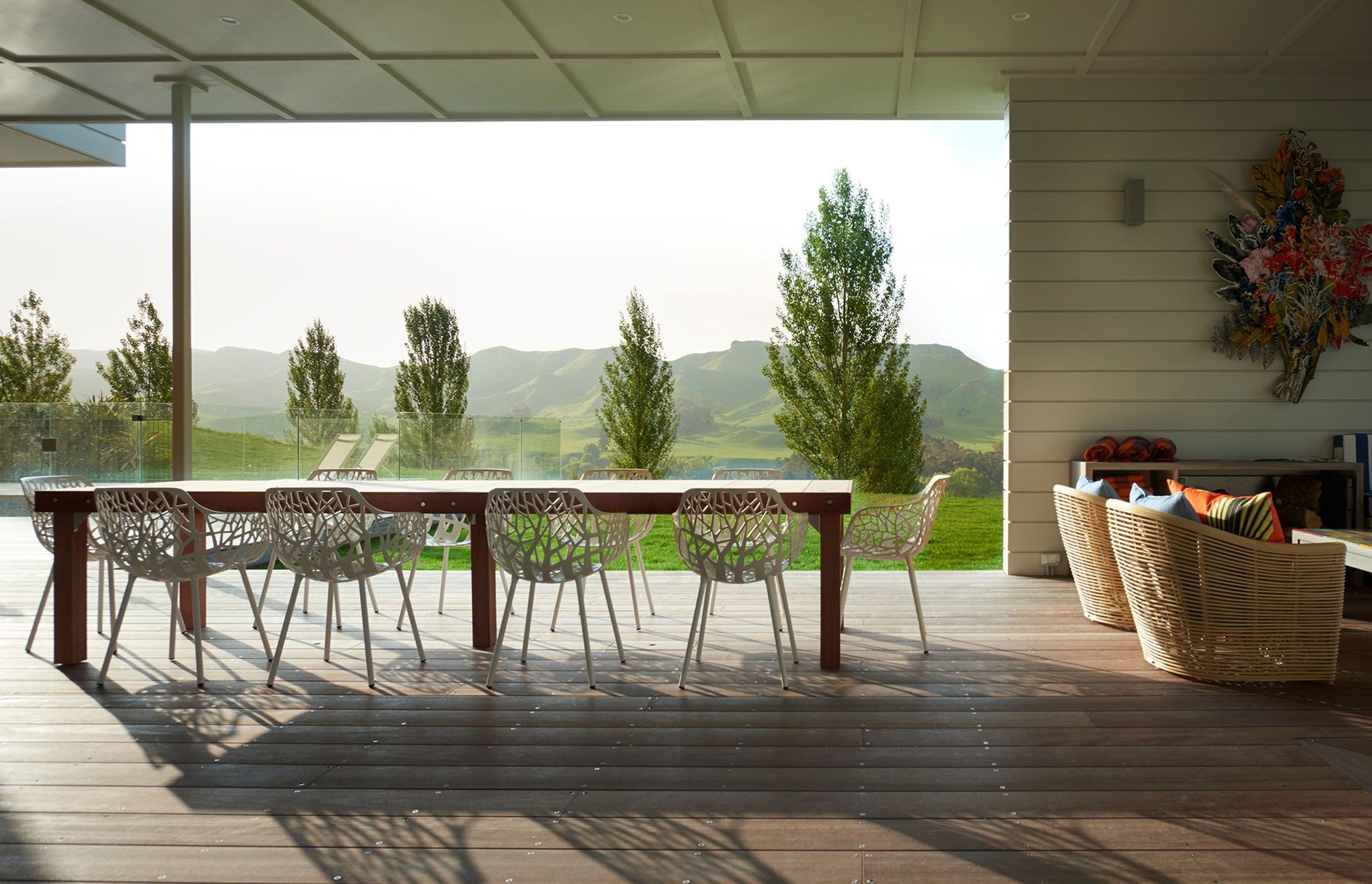 In the outdoor room, cedar weatherboard cladding has been continued from the exterior to complement the beautiful timber decking.