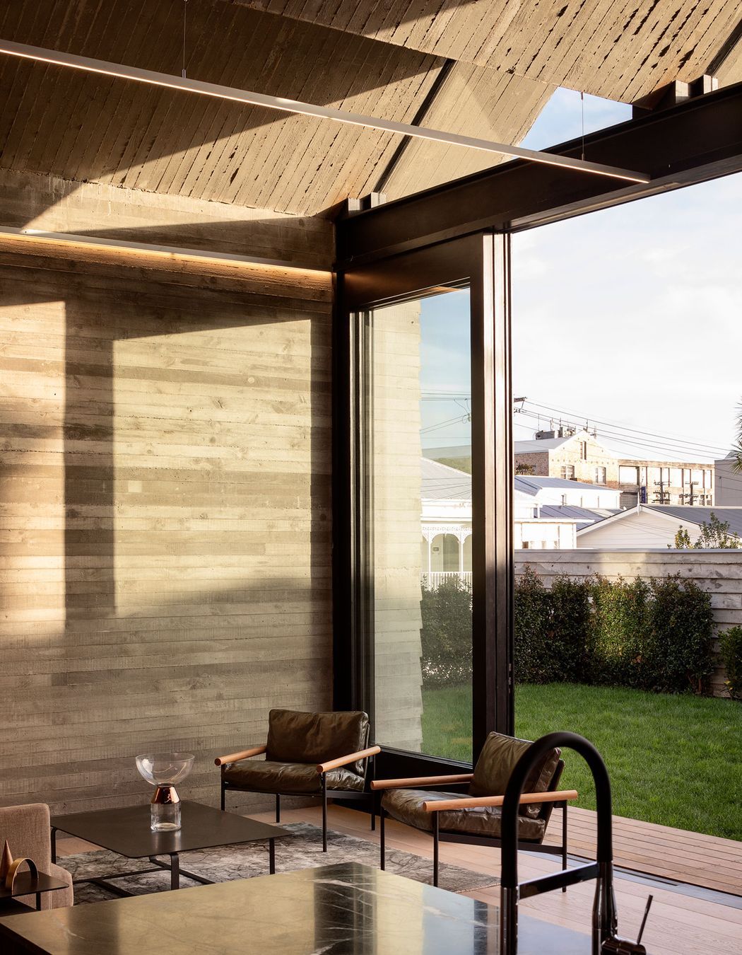 Shuttered concrete creates a dramatic textural wall, seen throughout the home.