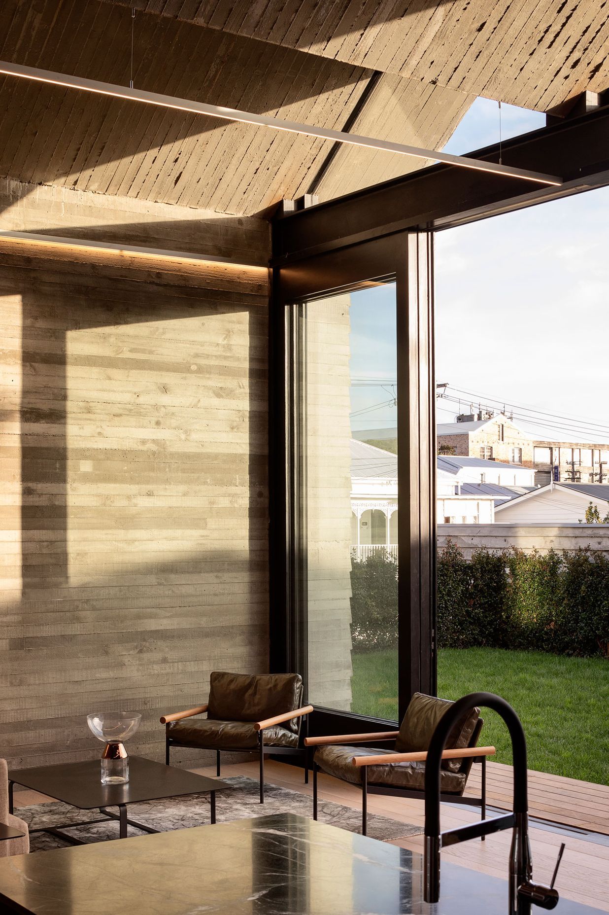 Shuttered concrete creates a dramatic textural wall, seen throughout the home.