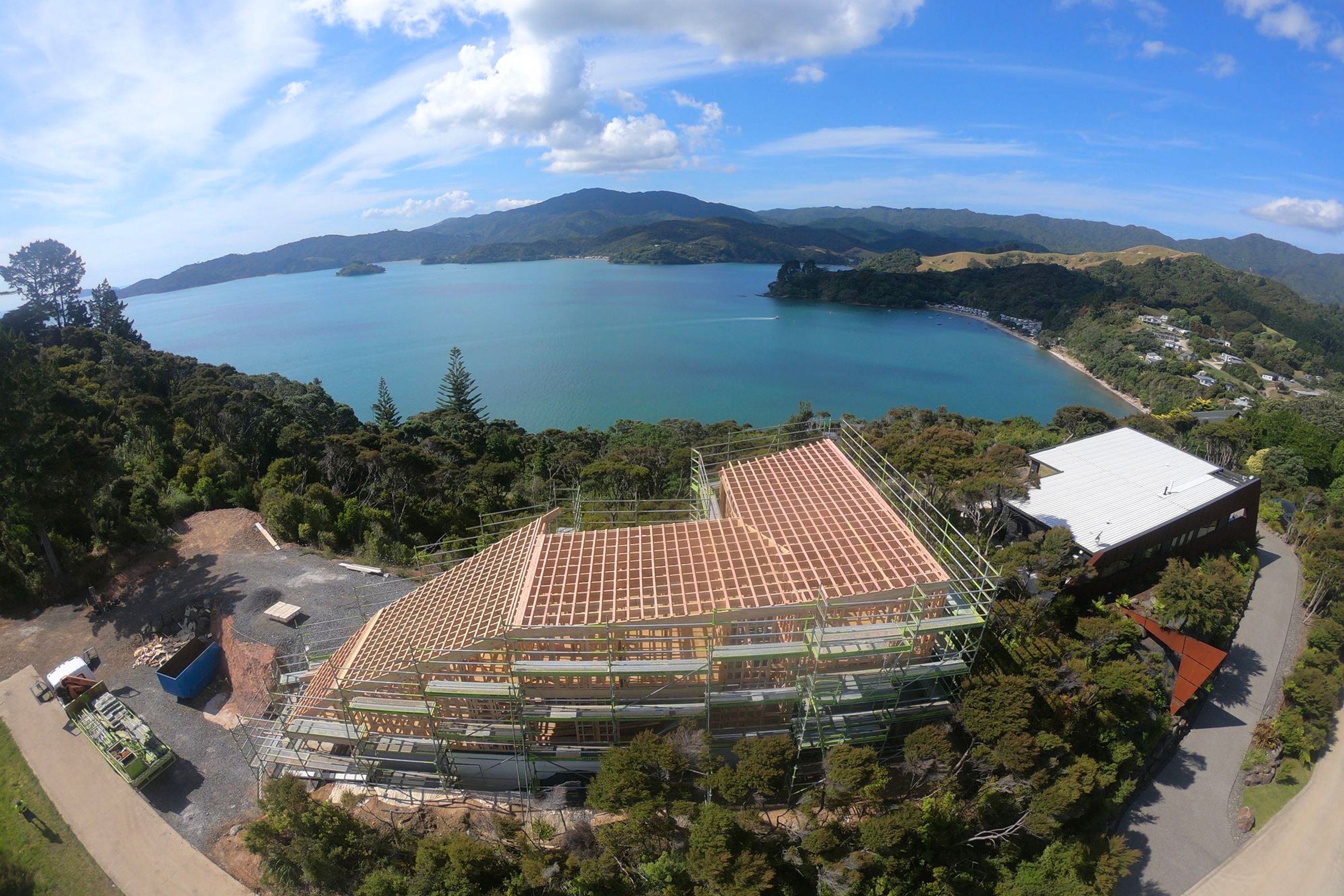 Another shot of the Kerr Ritchie Architects Wyuna Bay house.  Amazing water views on either side. Here are the bare bones of the roof structure on which we installed Trimrib® TS .55 COLORSTEEL® MAXX® in ‘Ironsand’   .  Photo credit to Sean King "Kiwi Way 
