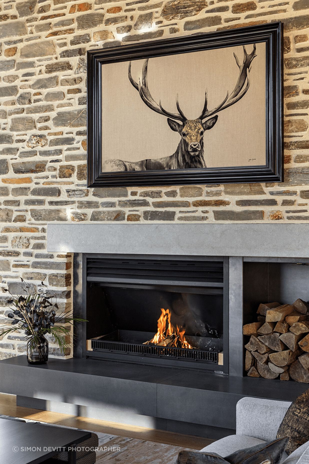The adults gather around the schist fireplace in the 'good' room.