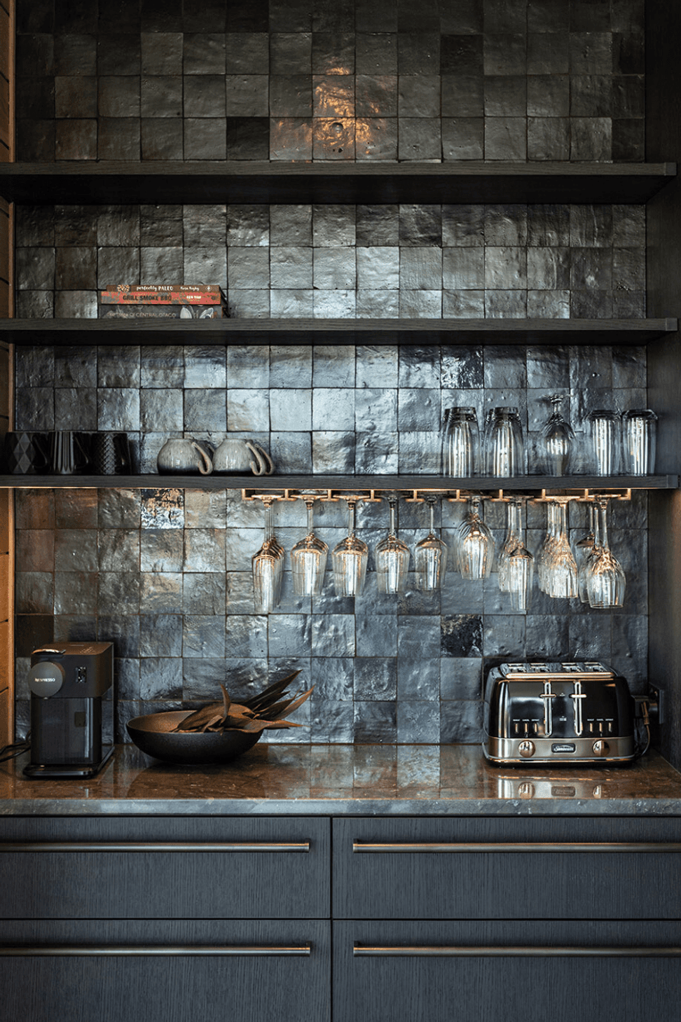 The kitchen scullery features custom cabinetry and steel hardware.
