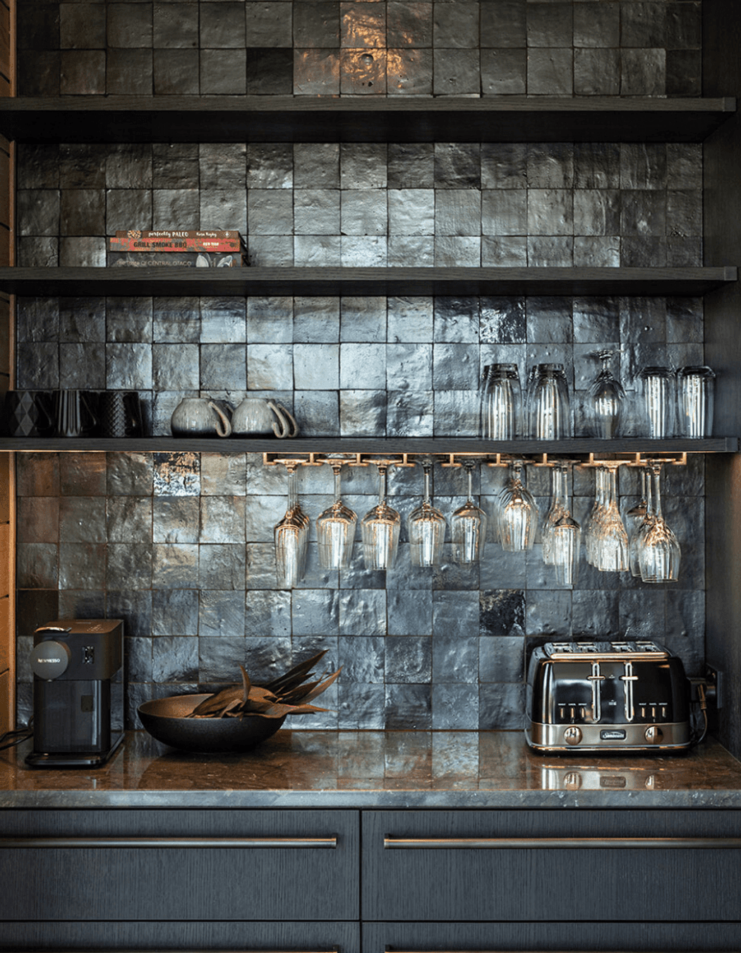 The kitchen scullery features custom cabinetry and steel hardware.