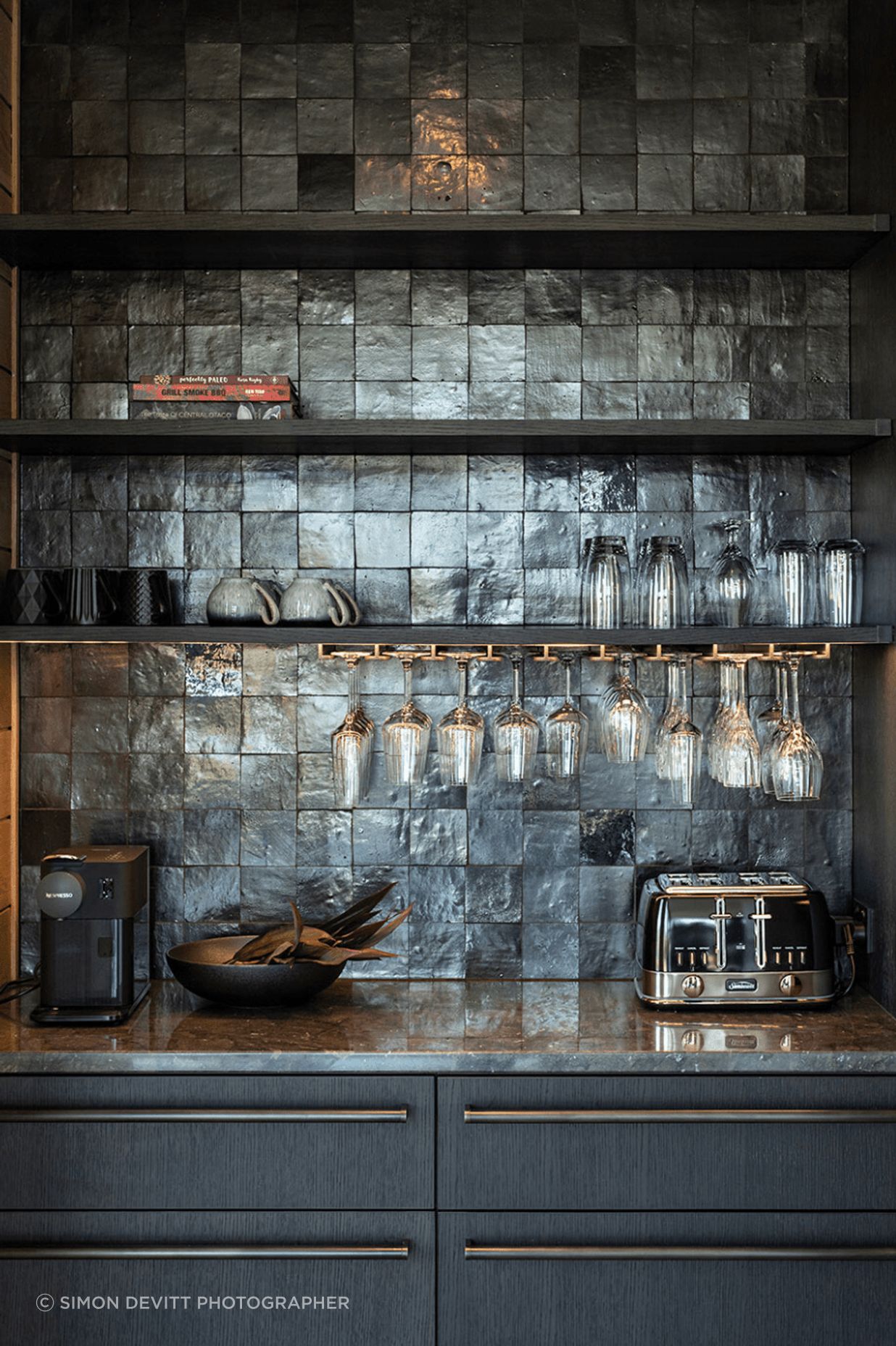 The kitchen scullery features custom cabinetry and steel hardware.