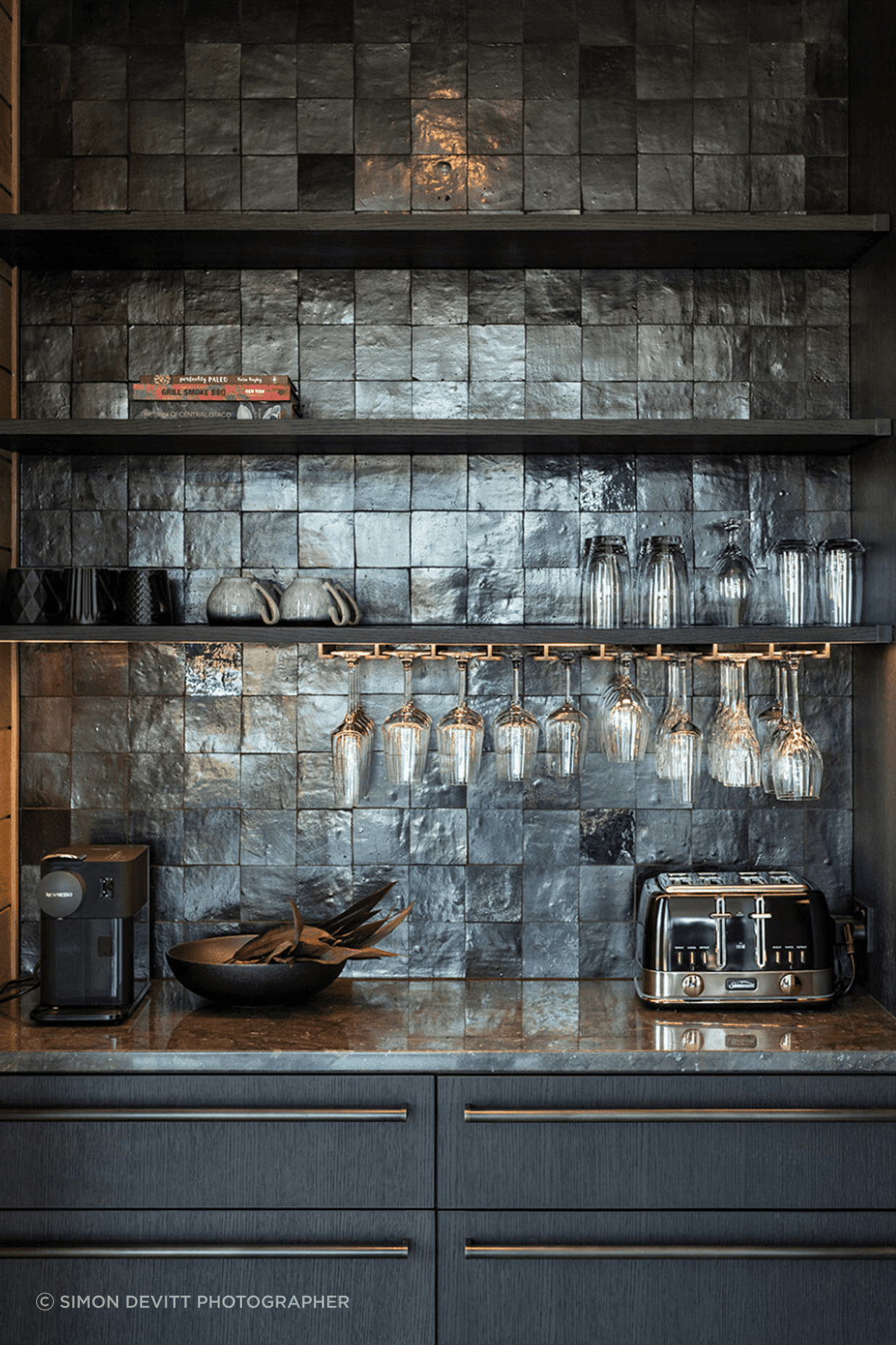 The kitchen scullery features custom cabinetry and steel hardware.