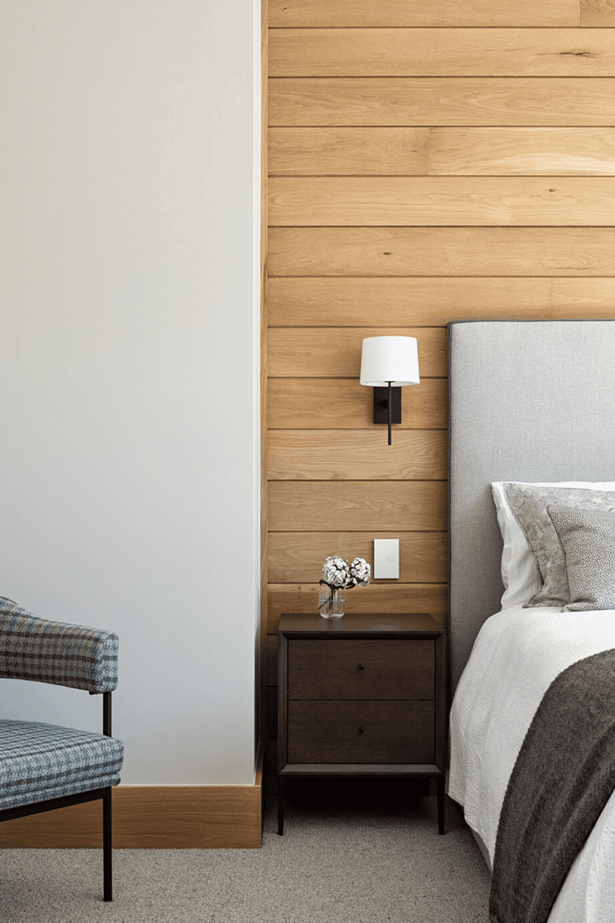 Oak timber lining in some of the guest rooms ties the material palette back to the land.