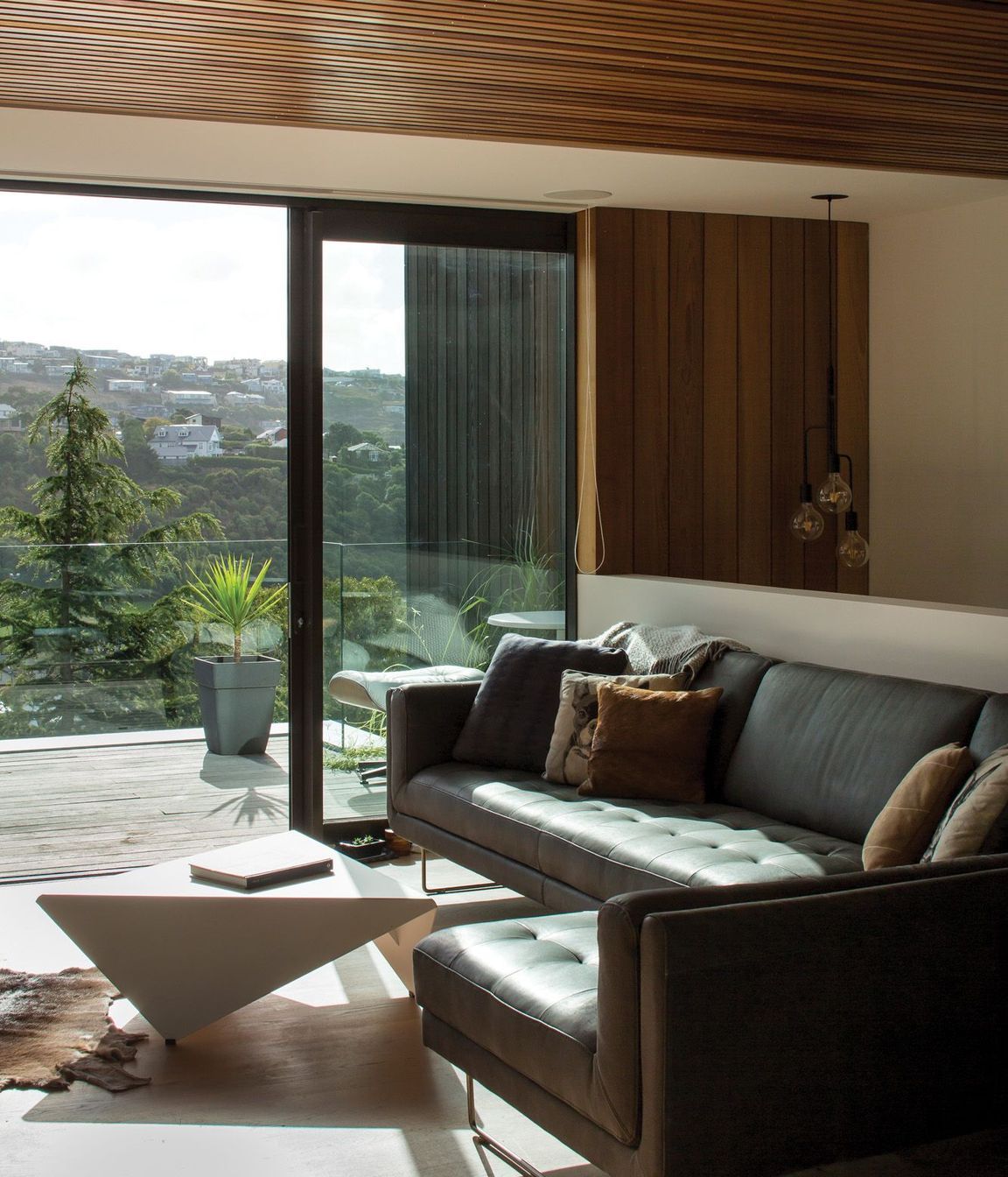 The snug opens onto a deck in front of the lap pool.