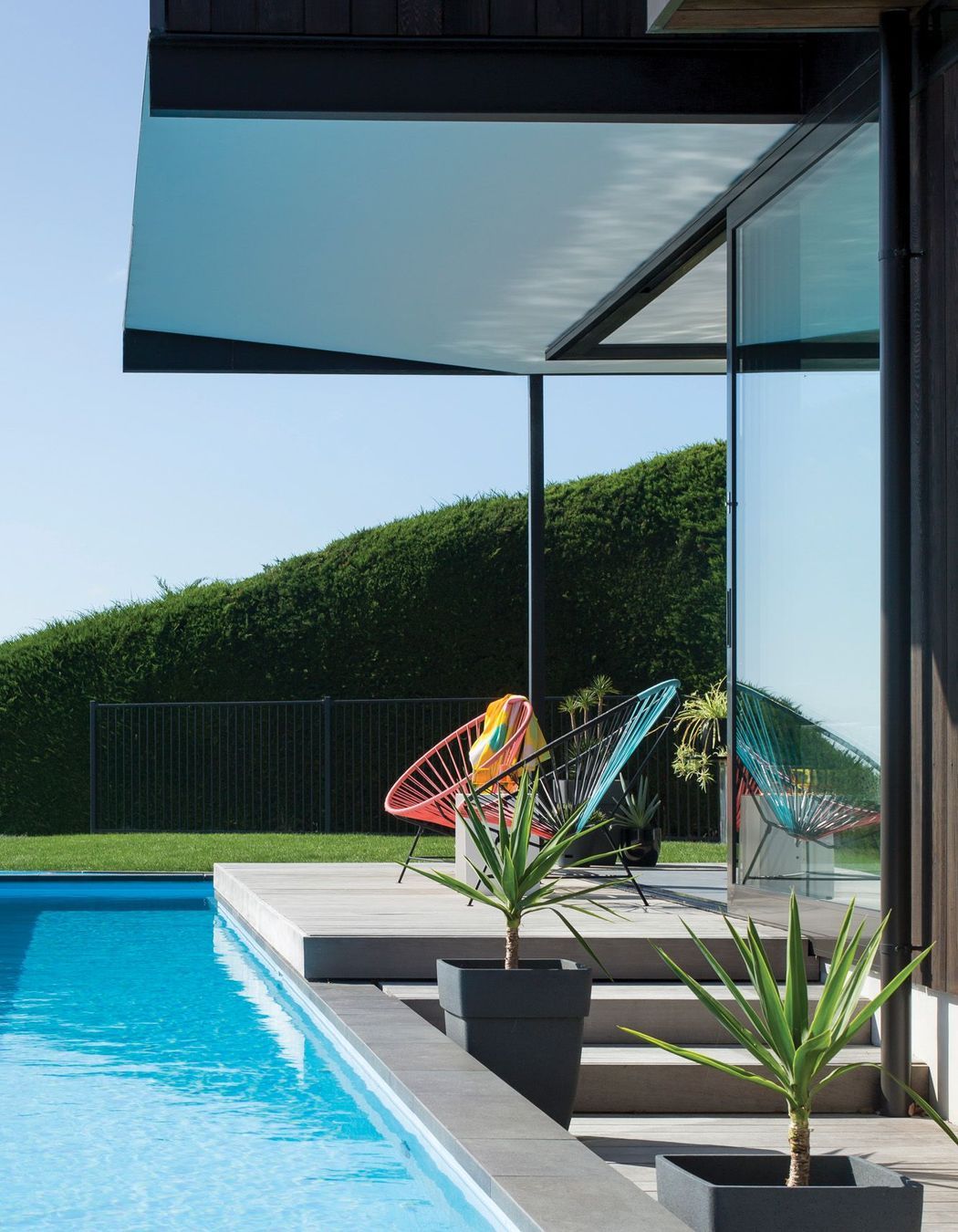  Obvious pool fencing in avoided through clever landscaping and screening.