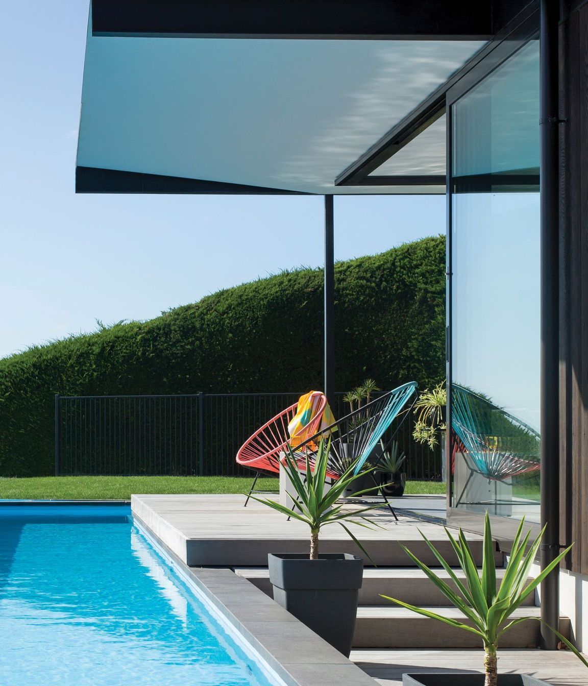  Obvious pool fencing in avoided through clever landscaping and screening.