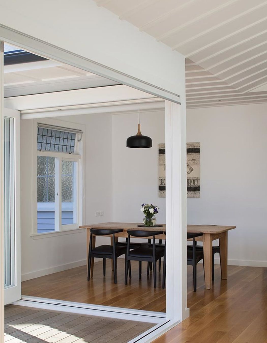 Floor-to-ceiling sliding doors encased in a clean, minimal design were the first step in realising the brief.