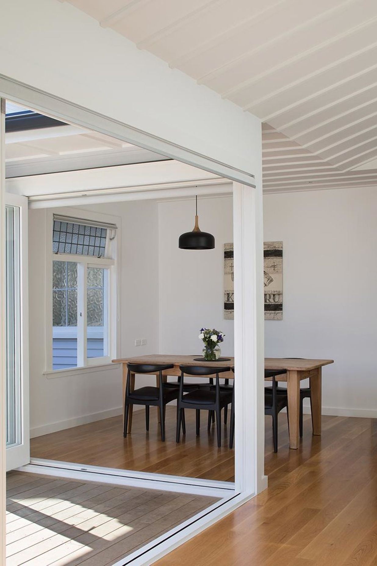 Floor-to-ceiling sliding doors encased in a clean, minimal design were the first step in realising the brief.