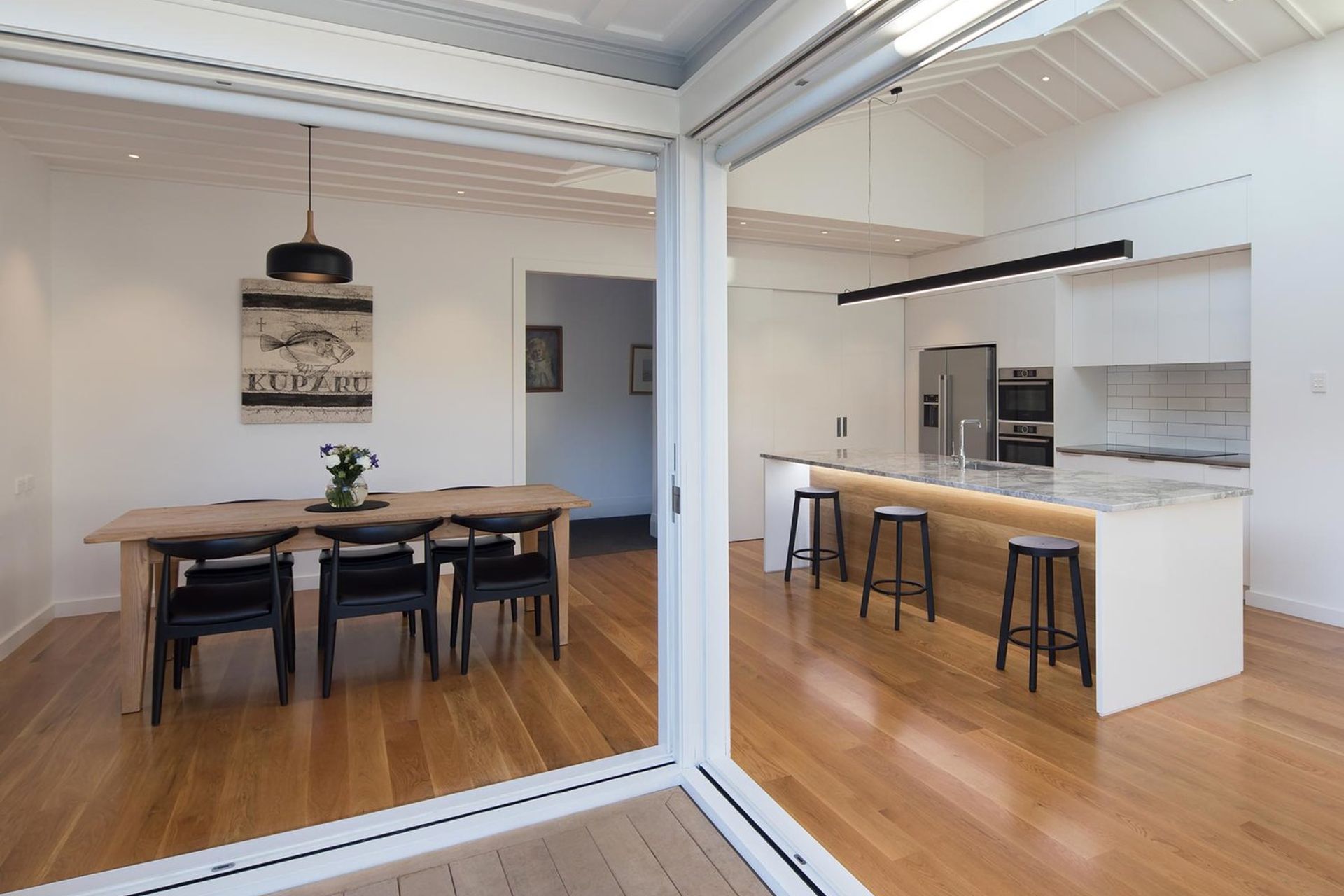 A clean, minimal aesthetic combined with removing internal and external walls realised an bright, open space.